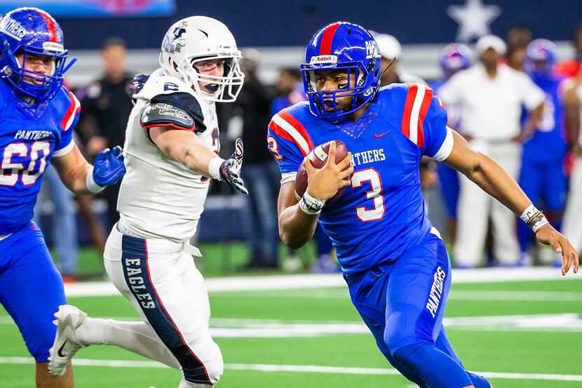 FILE - Duncanville quarterback Ja'Quinden Jackson (3) scores on an 8-yard touchdown run...