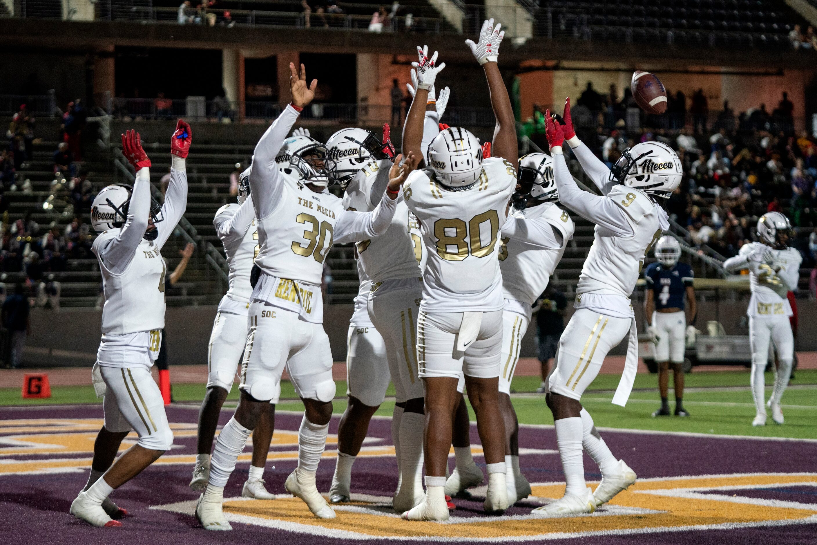 South Oak Cliff players celebrate an interception returned for a touchdown by senior...