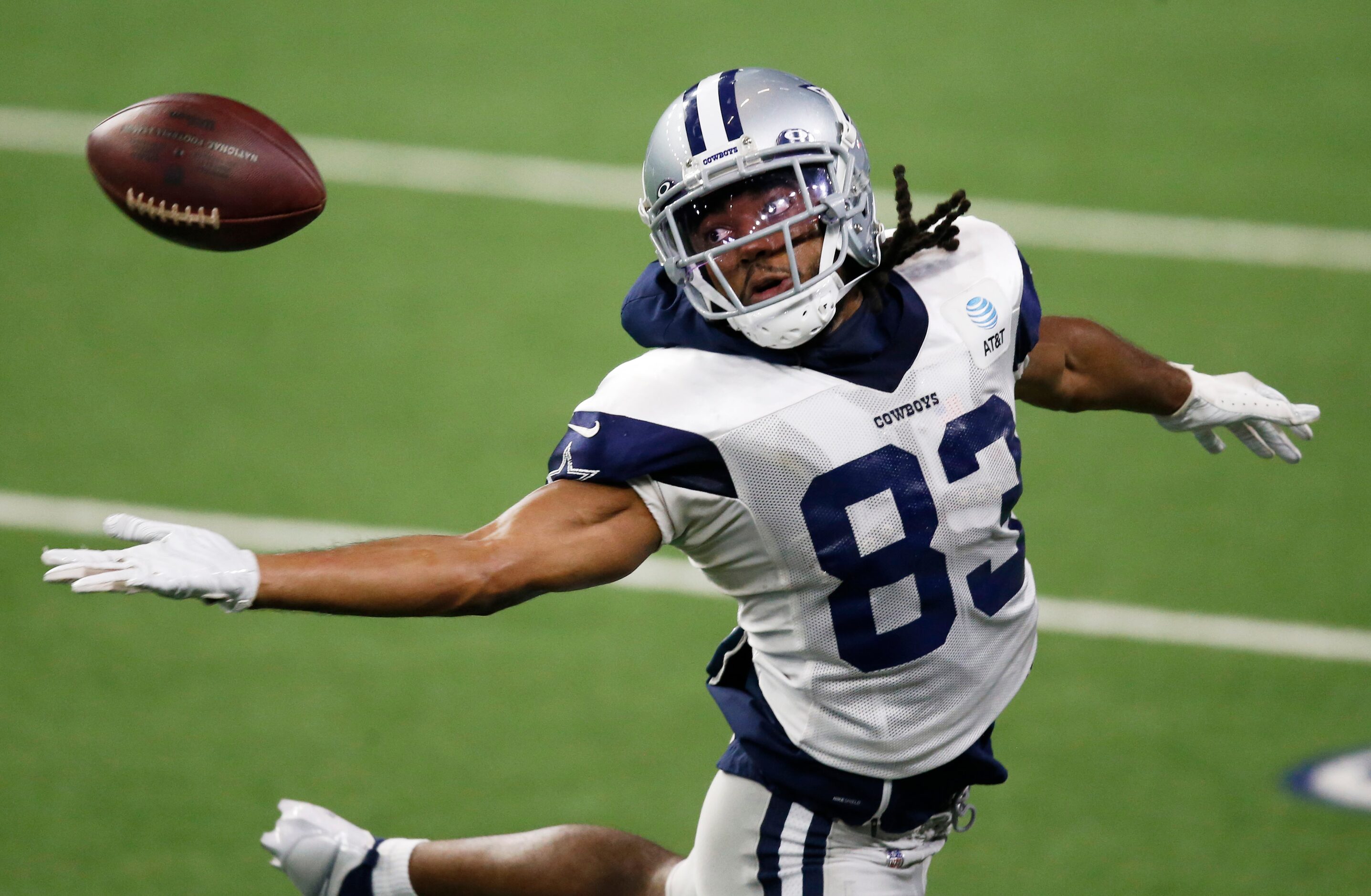 Dallas Cowboys wide receiver Ventell Bryant (83) reaches for the ball in a drill during...