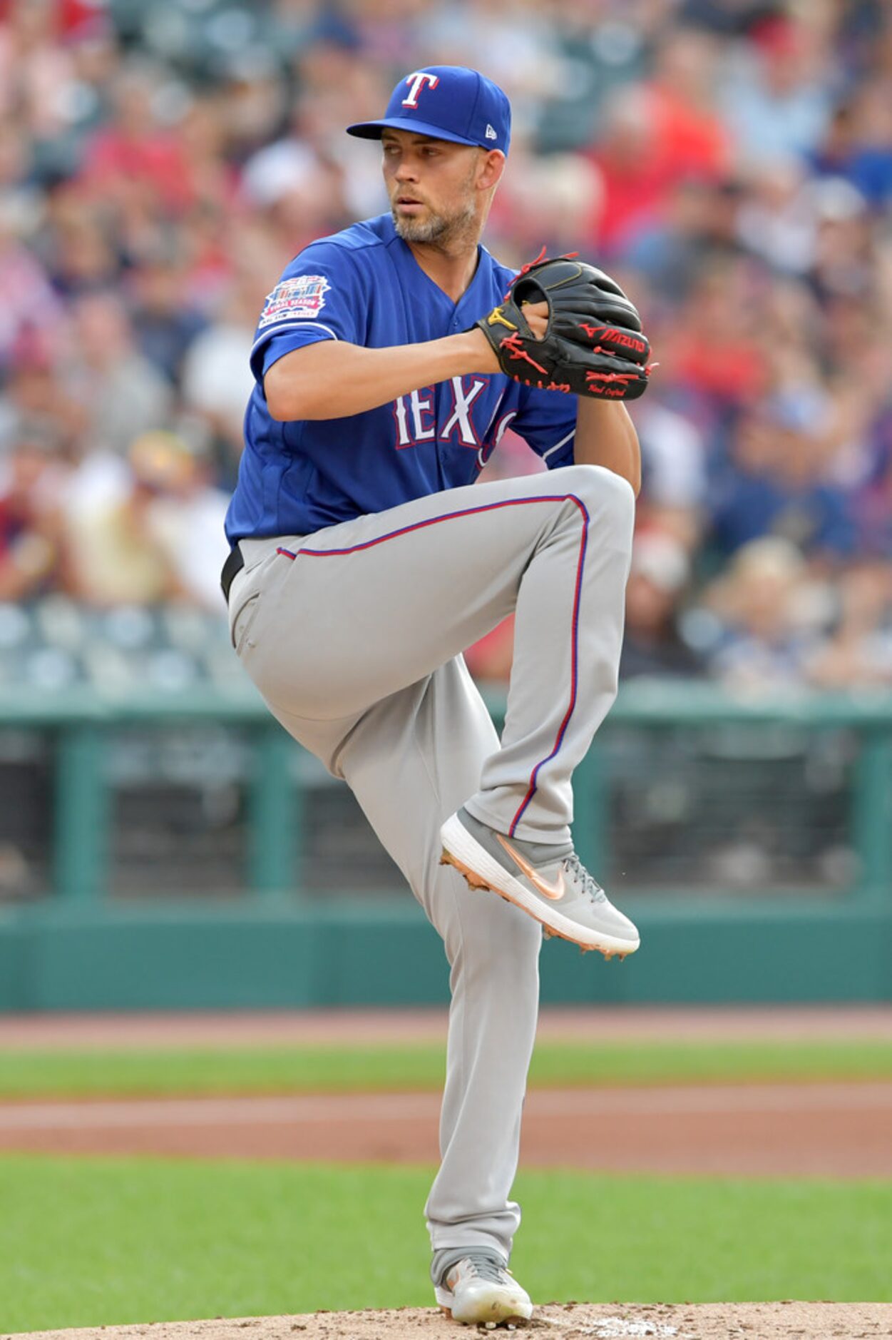 CLEVELAND, OHIO - AUGUST 05: Starting pitcher Mike Minor #23 of the Texas Rangers pitches...