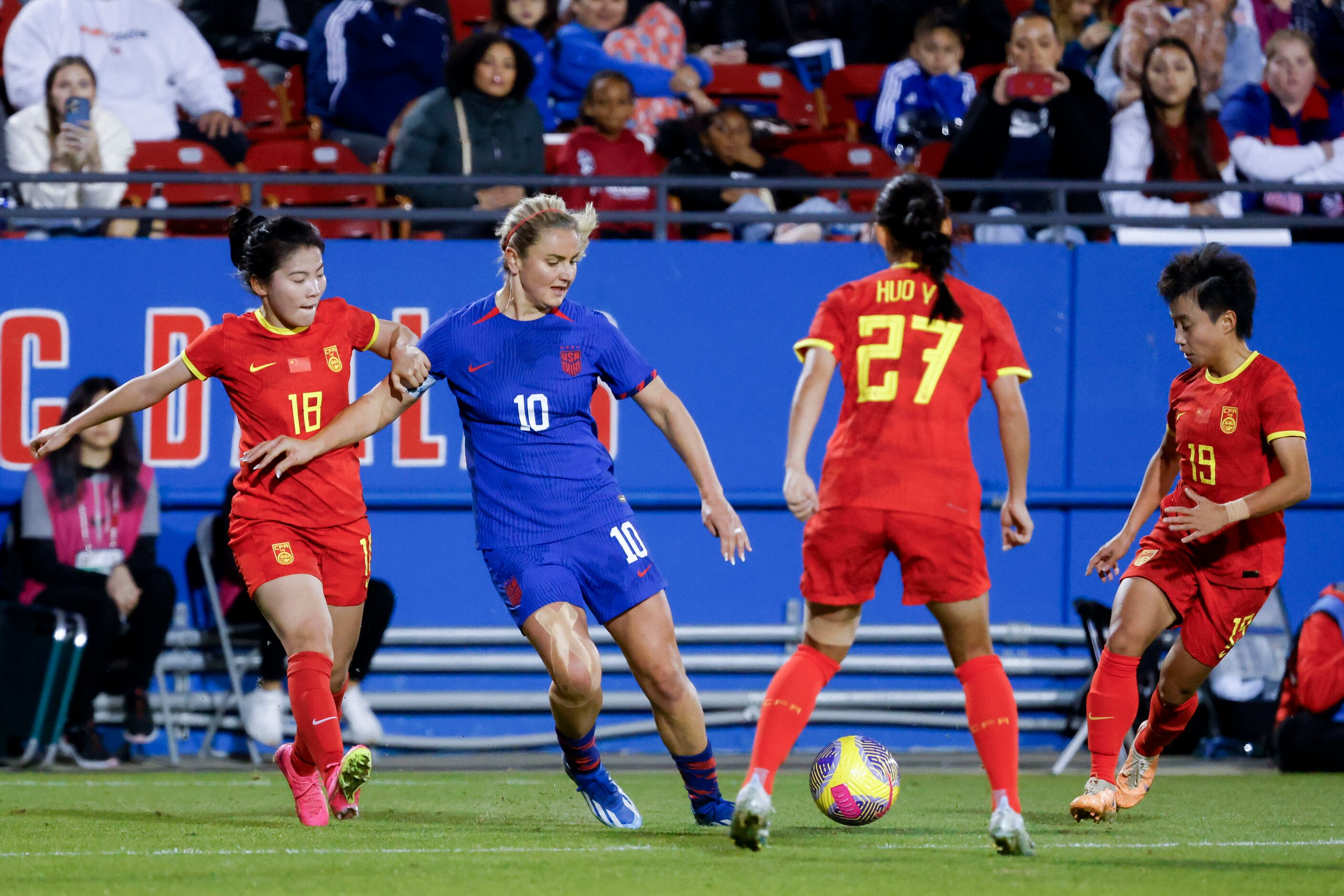 United States midfielder Lindsey Horan (10) dribbles past China’s Shen Menglu (18), Huo...