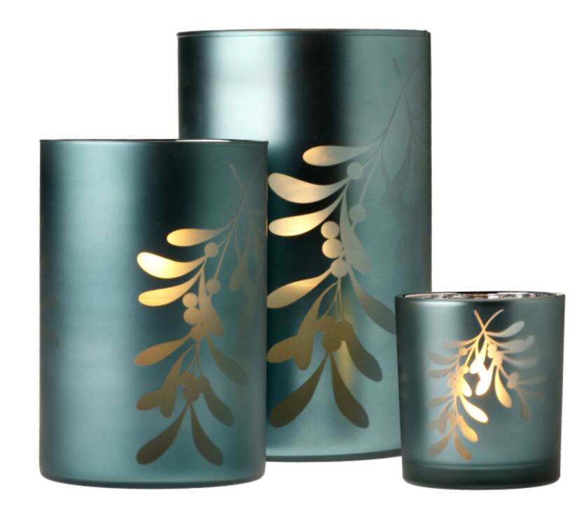 Add a silvery glow to mantel or table with blue frosted votive and tea-light holders with...