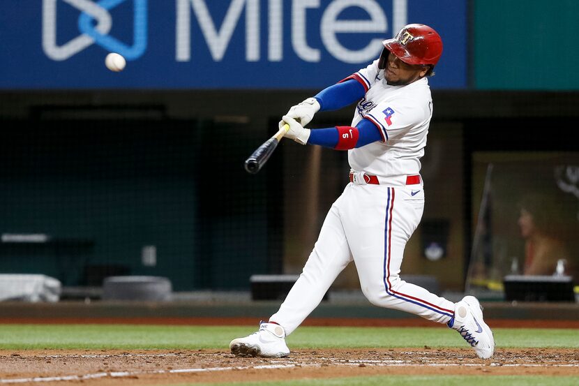 Texas Rangers left fielder Willie Calhoun (5) hits the ball during the third inning against...