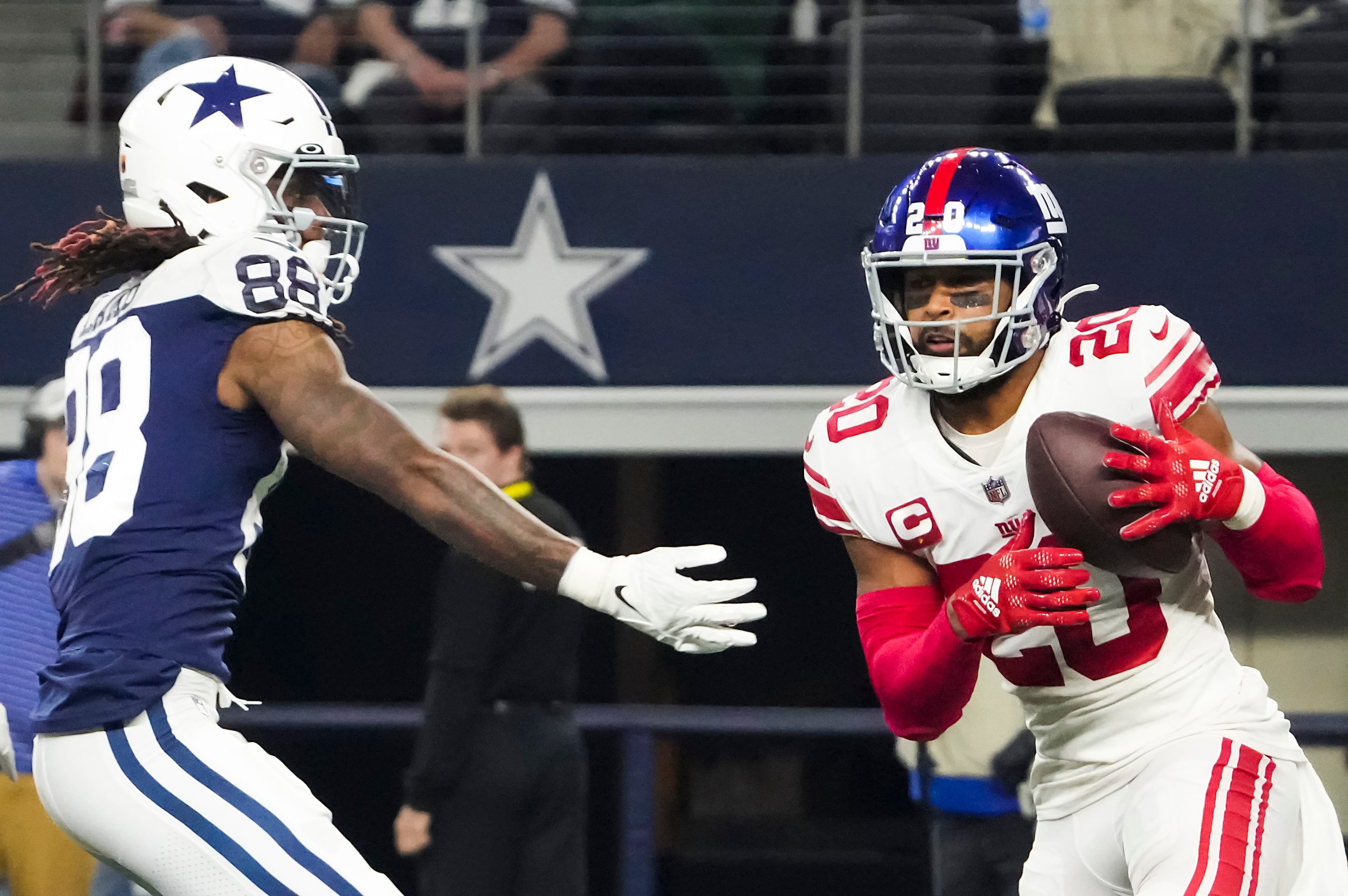 New York Giants safety Julian Love (20) intercepts a pass intended for Dallas Cowboys wide...