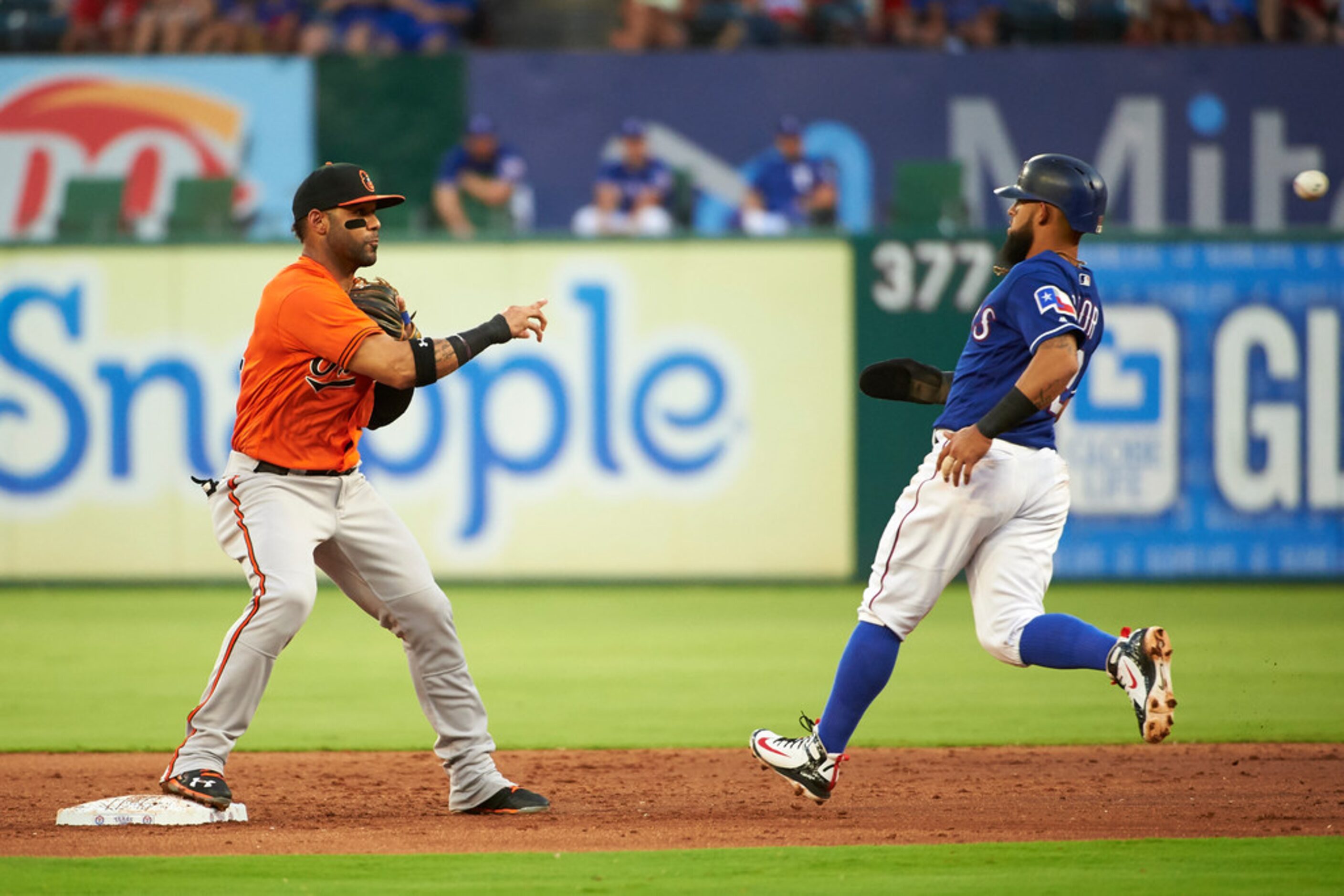 Baltimore Orioles' Jonathan Villar turns a double play against the Texas Rangers during the...