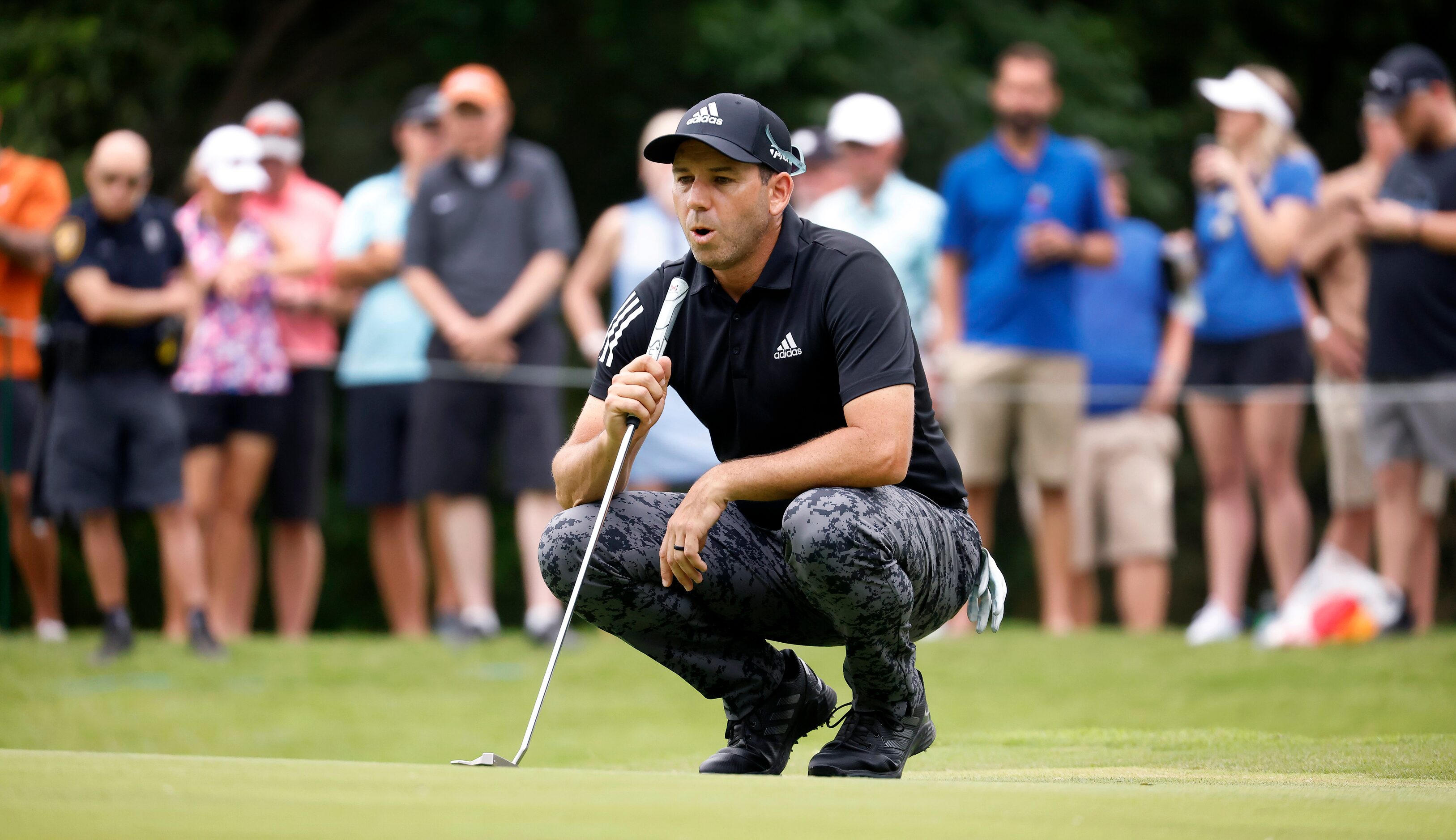 Professional golfer Sergio Garcia takes a deep breath before putting a birdie on No. 8...