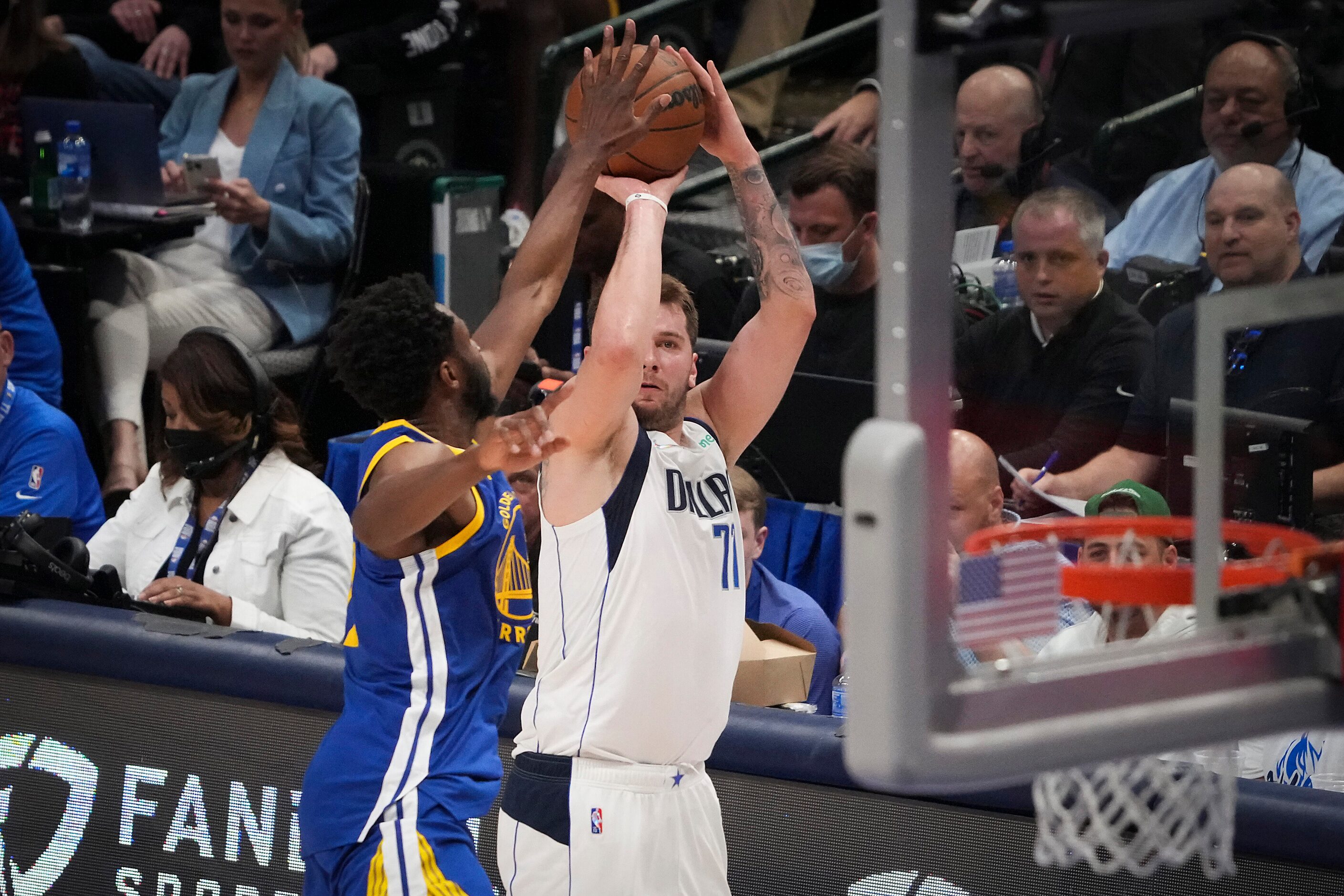 Dallas Mavericks guard Luka Doncic (77) shoots a 3-pointer as Golden State Warriors forward...