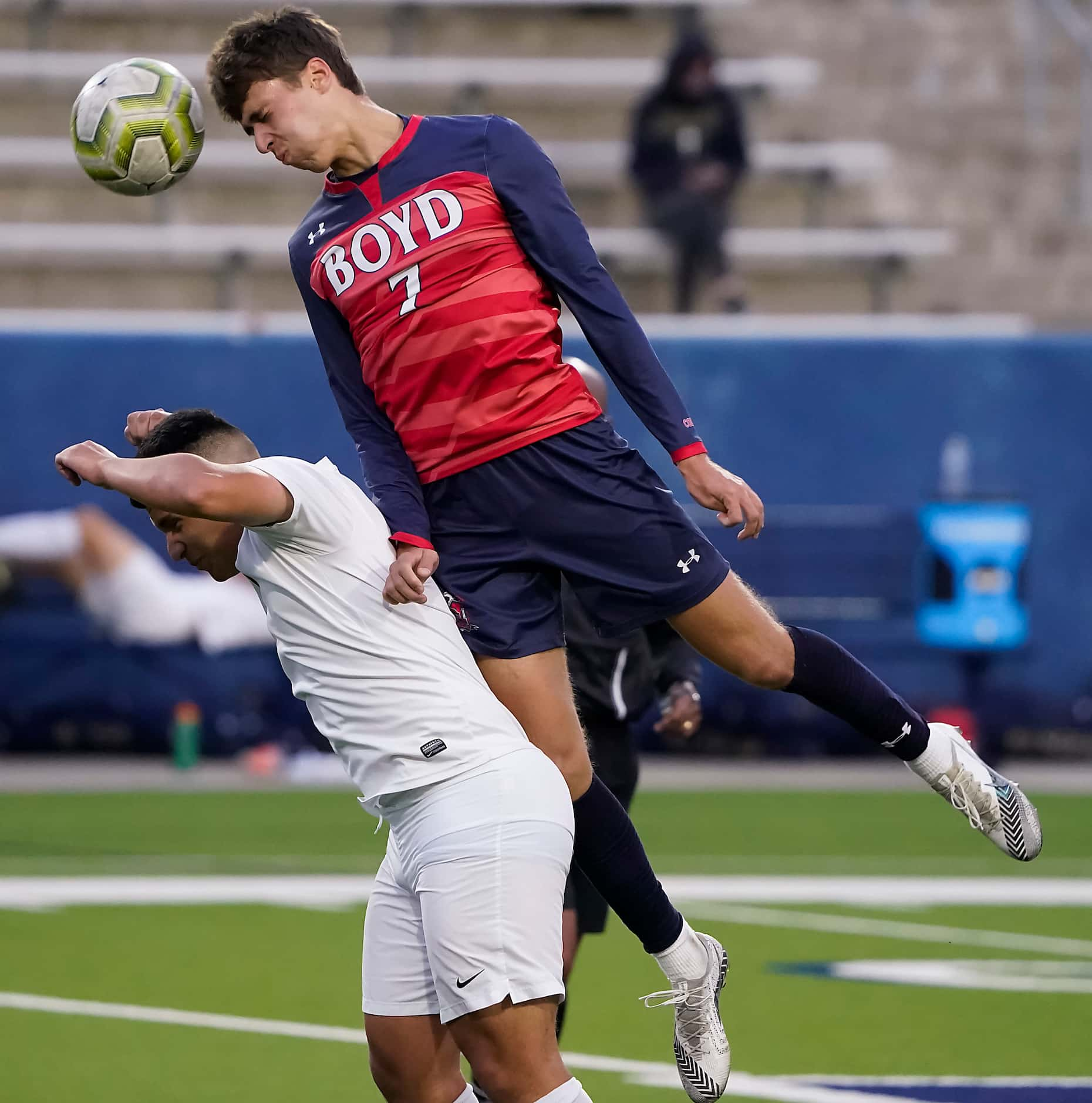 McKinney Boyd forward Spencer Sarkissian (7) goes over the top of Jesuit midfielder Arnold...