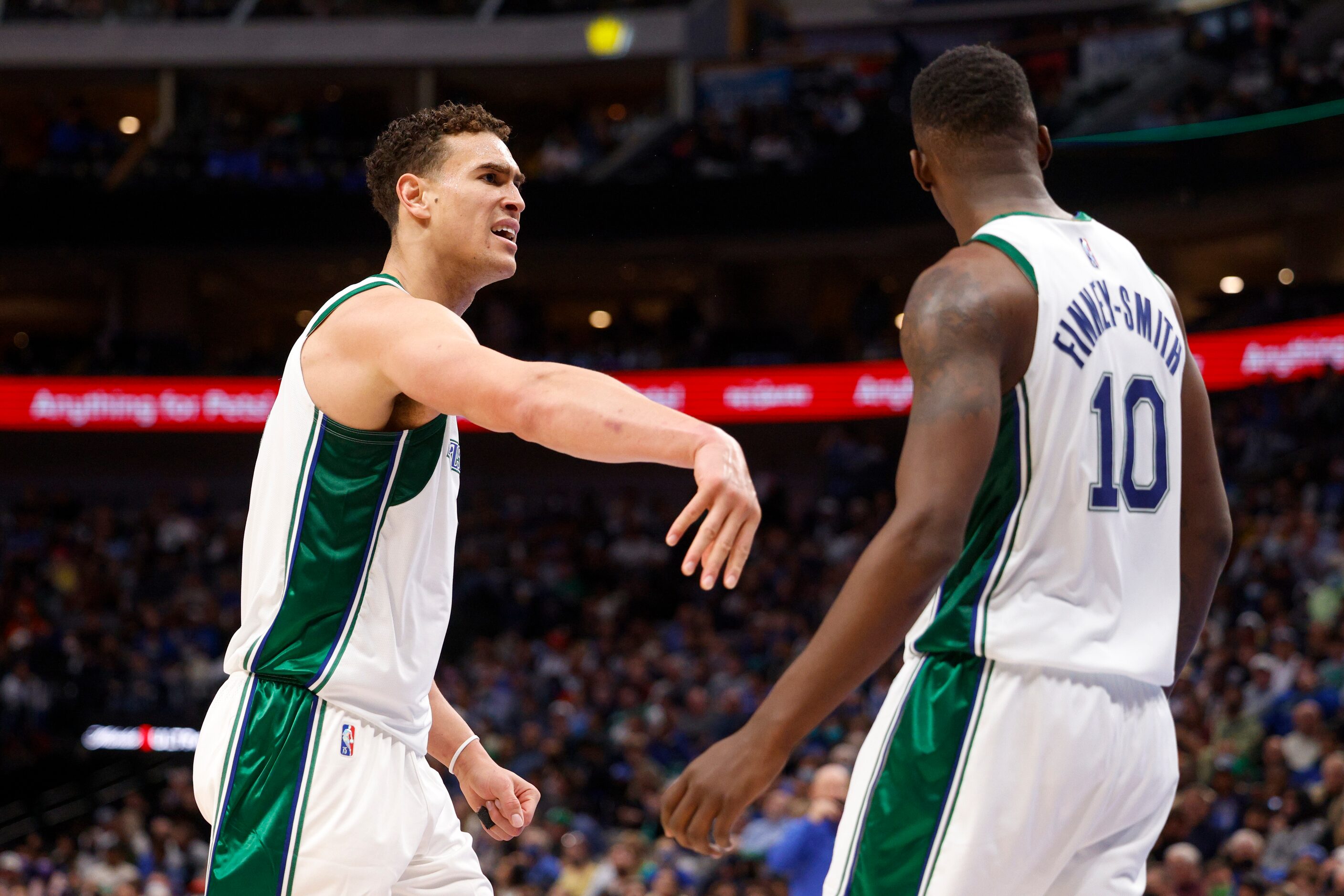 Dallas Mavericks center Dwight Powell (7) pushes Dallas Mavericks forward Dorian...