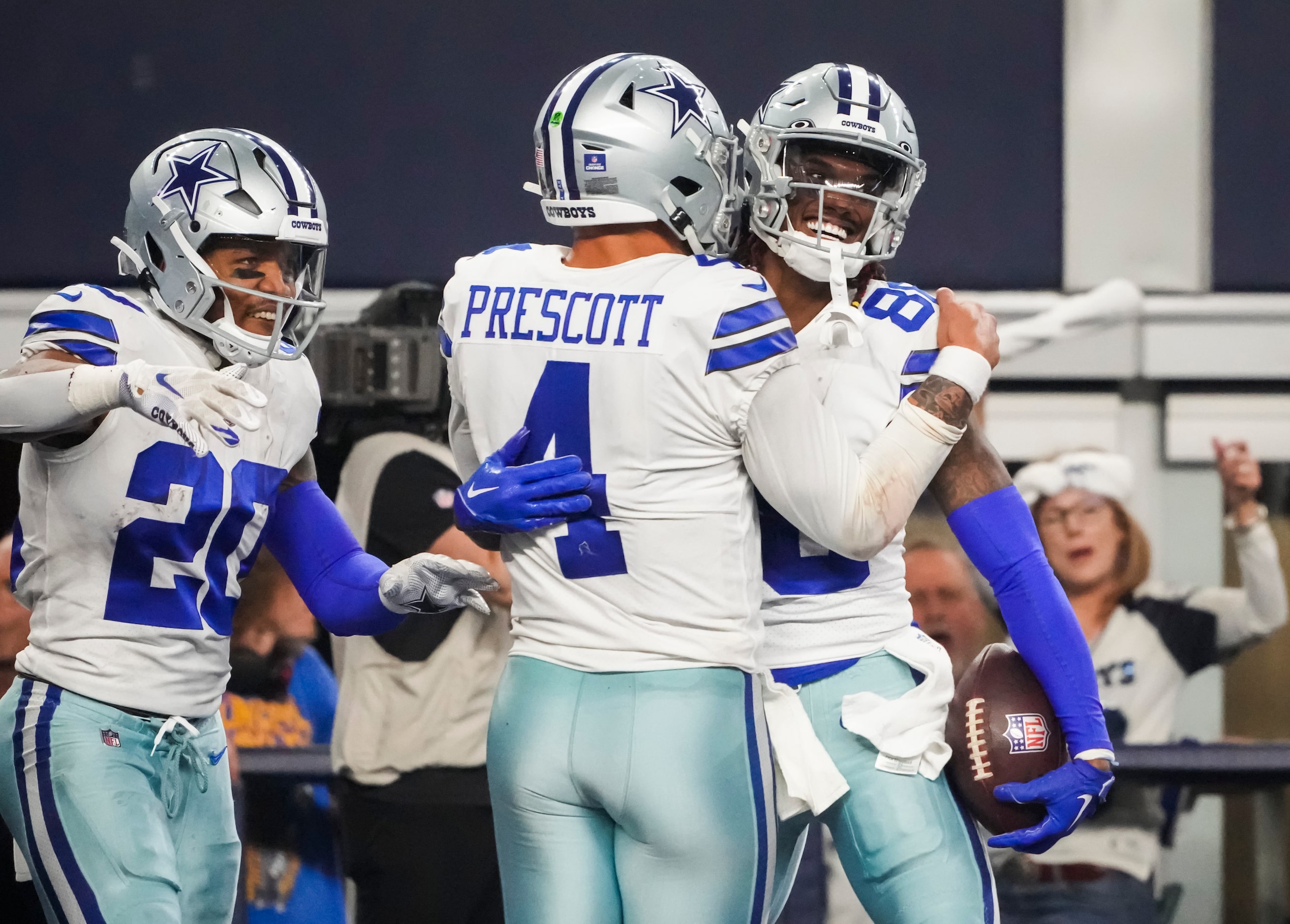 Dallas Cowboys wide receiver CeeDee Lamb (88) celebrates with quarterback Dak Prescott (4)...