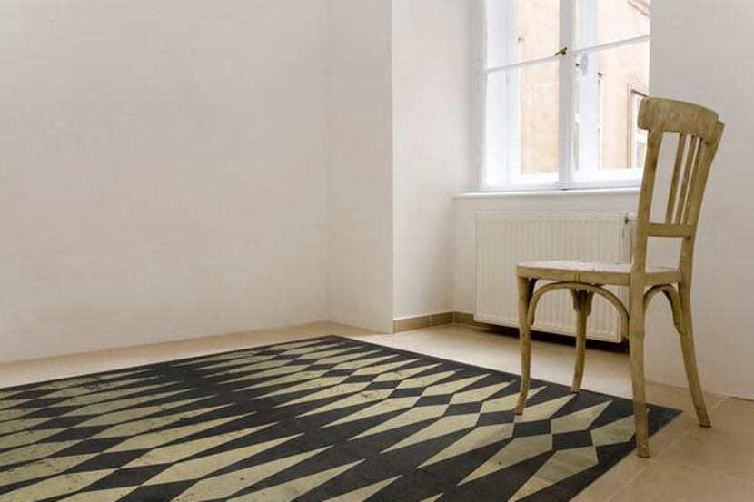 
Vinyl floor cloths made to look like you grandmother's old floor are available at Gray...
