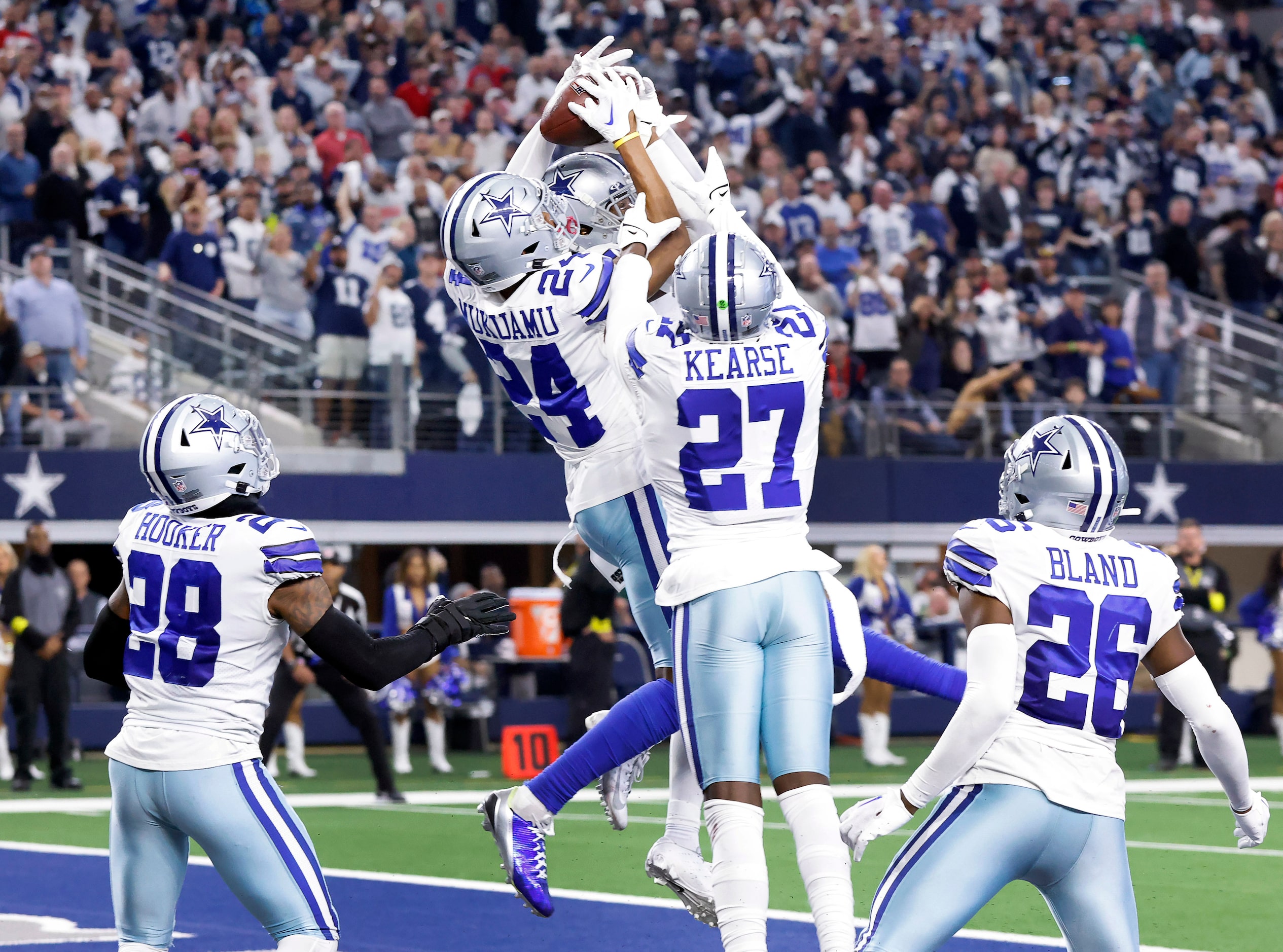 Dallas Cowboys safety Israel Mukuamu (24) goes up to catch a Hail Mary pass by Houston...