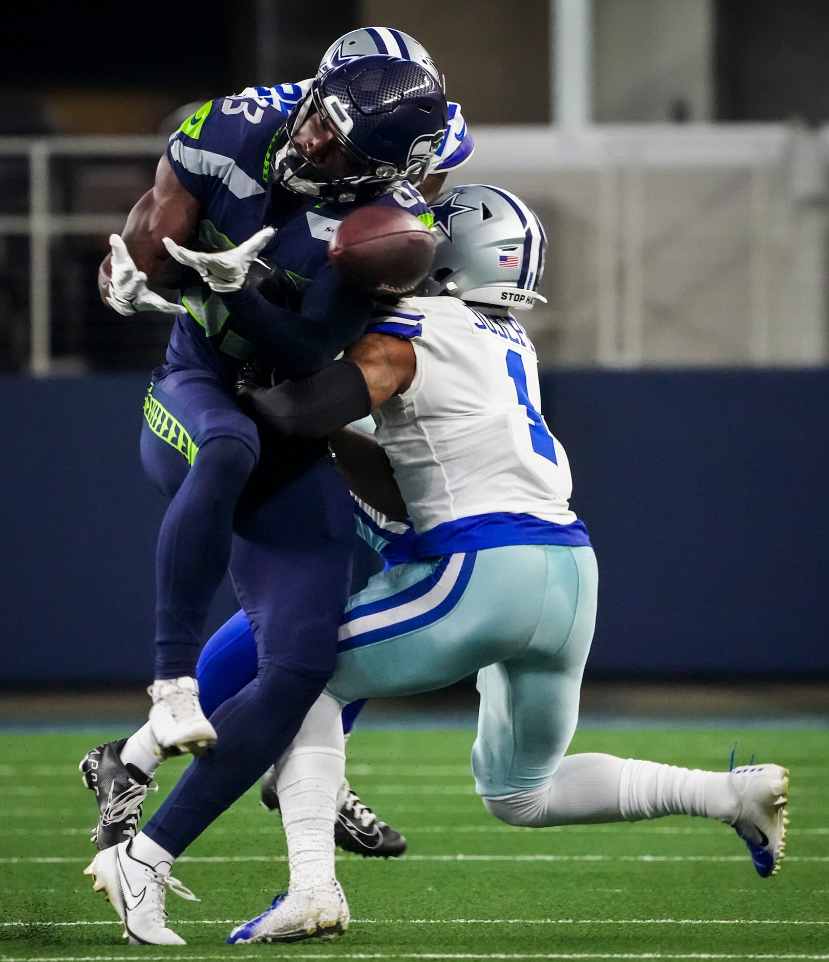 Seattle Seahawks wide receiver Dareke Young (83) can’t haul in a pass as he is hit by Dallas...