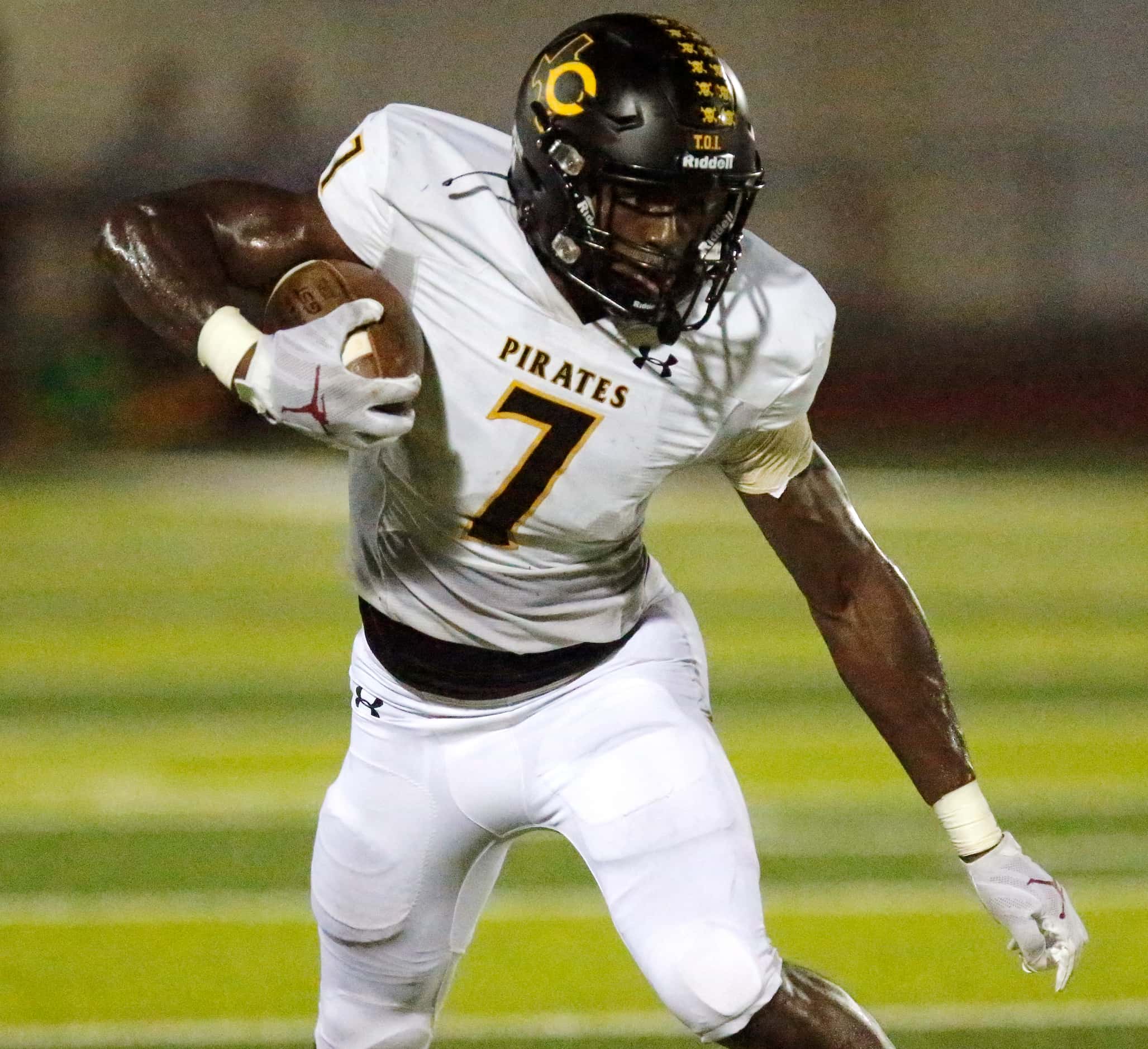 Crandall High School wide receiver Samuel Omosigho (7) looks for room to run after the catch...