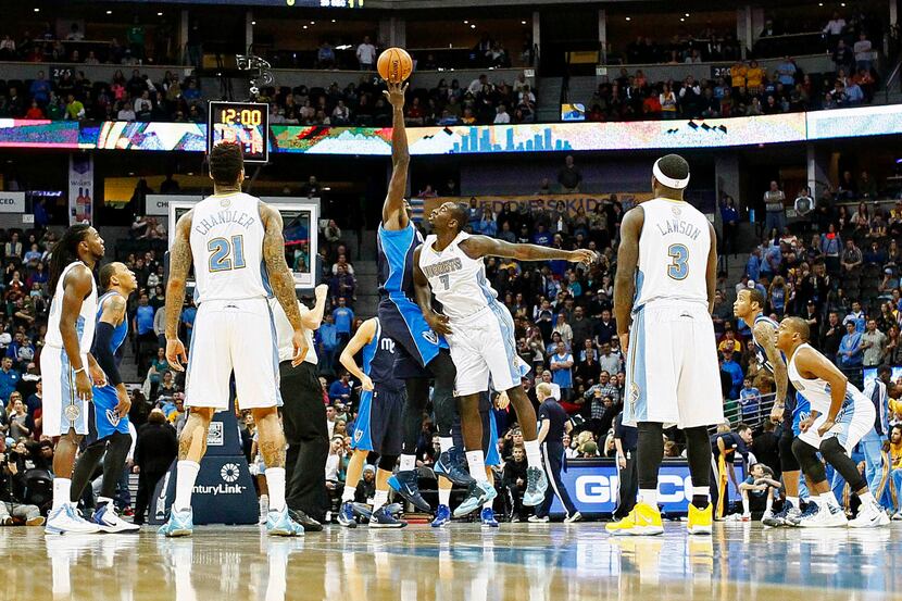 Nov 23, 2013; Denver, CO, USA; Dallas Mavericks center Samuel Dalembert (1) tips off against...