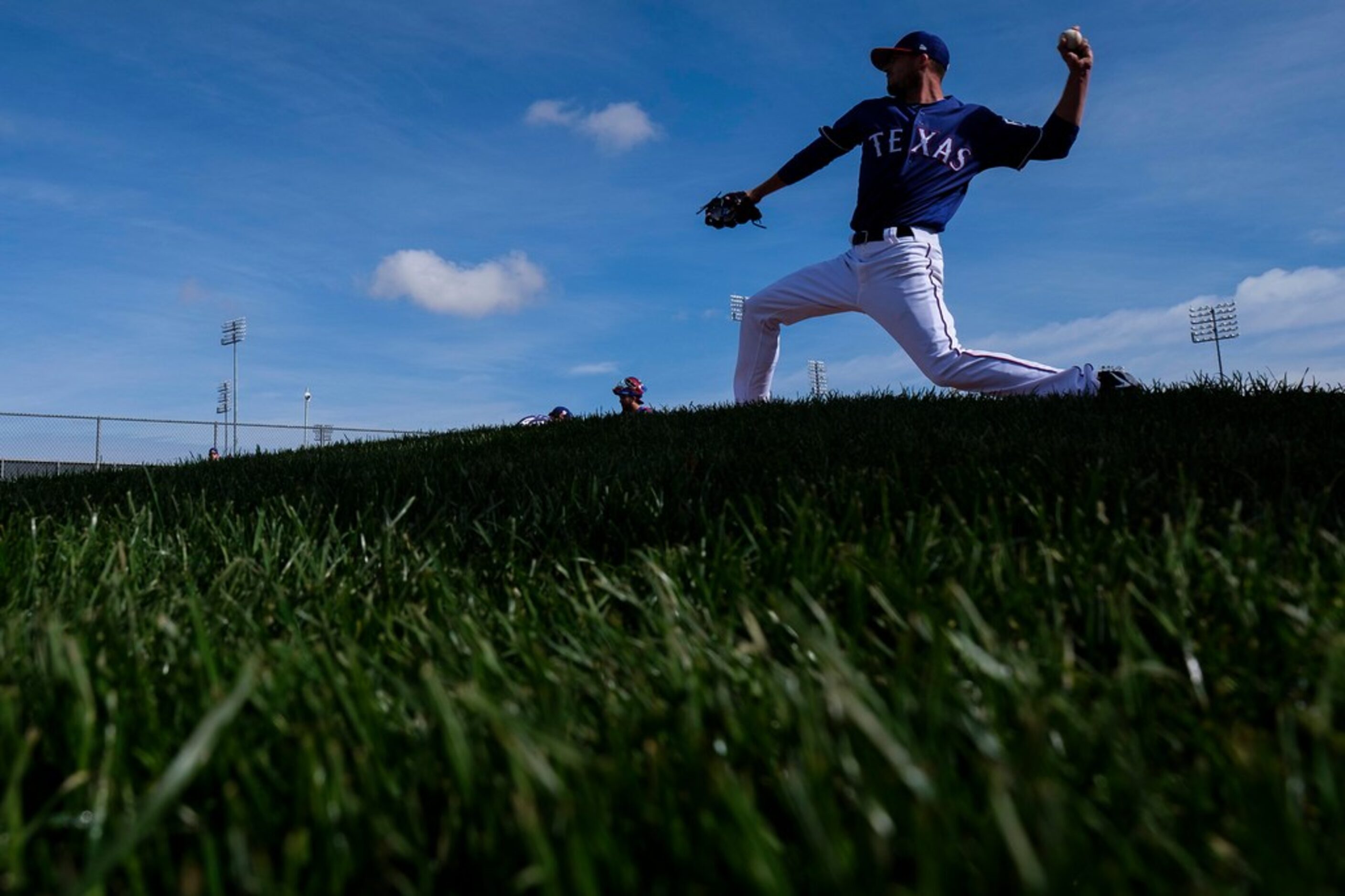 Texas Rangers pitcher Drew Smyly throws in the bullpen during a spring training workout at...