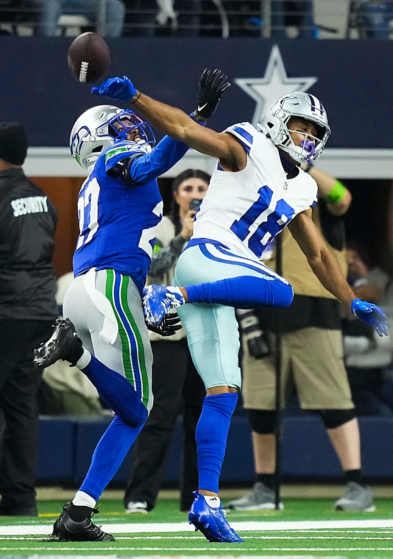 Seattle Seahawks cornerback Riq Woolen (27) commits a pass interference against Dallas...