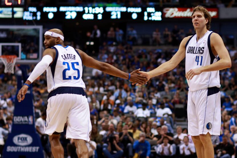 Dallas Mavericks power forward Dirk Nowitzki (41) shakes hands with teammate Dallas...