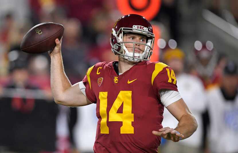 FILE - Southern California quarterback Sam Darnold prepares to throw a pass during the first...