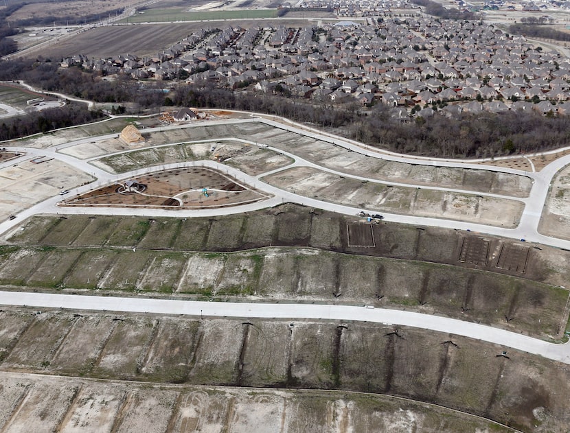 Housing developments like this one under construction in Frisco are among the countless...