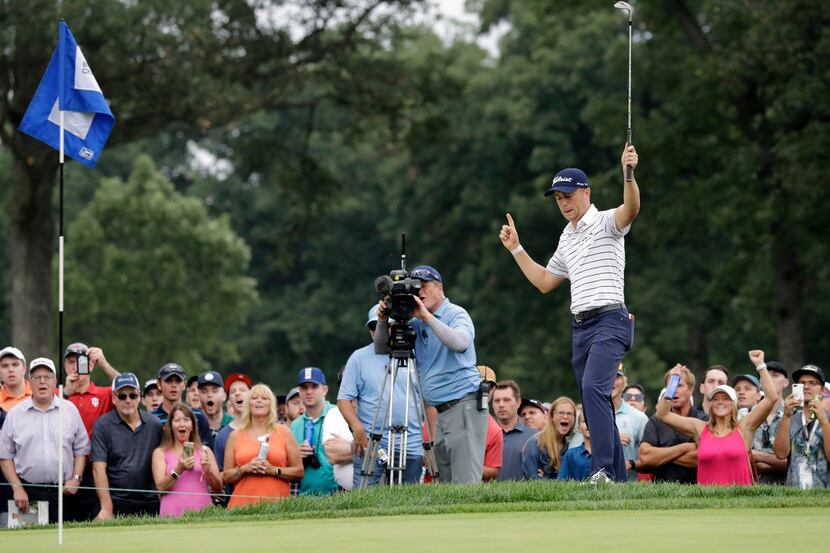 Justin Thomas celebrates after making a birdie on the 14th hole during the third round of...