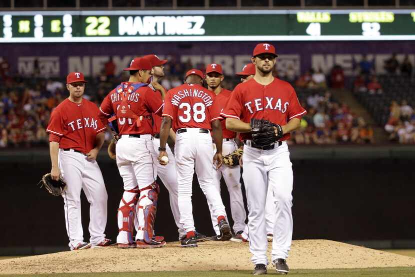 Texas Rangers starting pitcher Nick Martinez (22) leaves the field in the 6th inning of MLB...