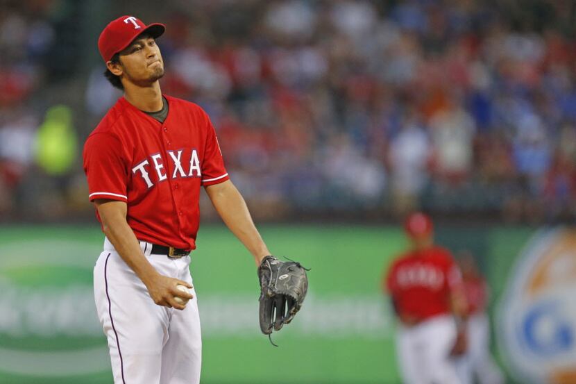 Texas pitcher Yu Darvish reacts after watching Asdrubal Cabrera's home run leave the park in...
