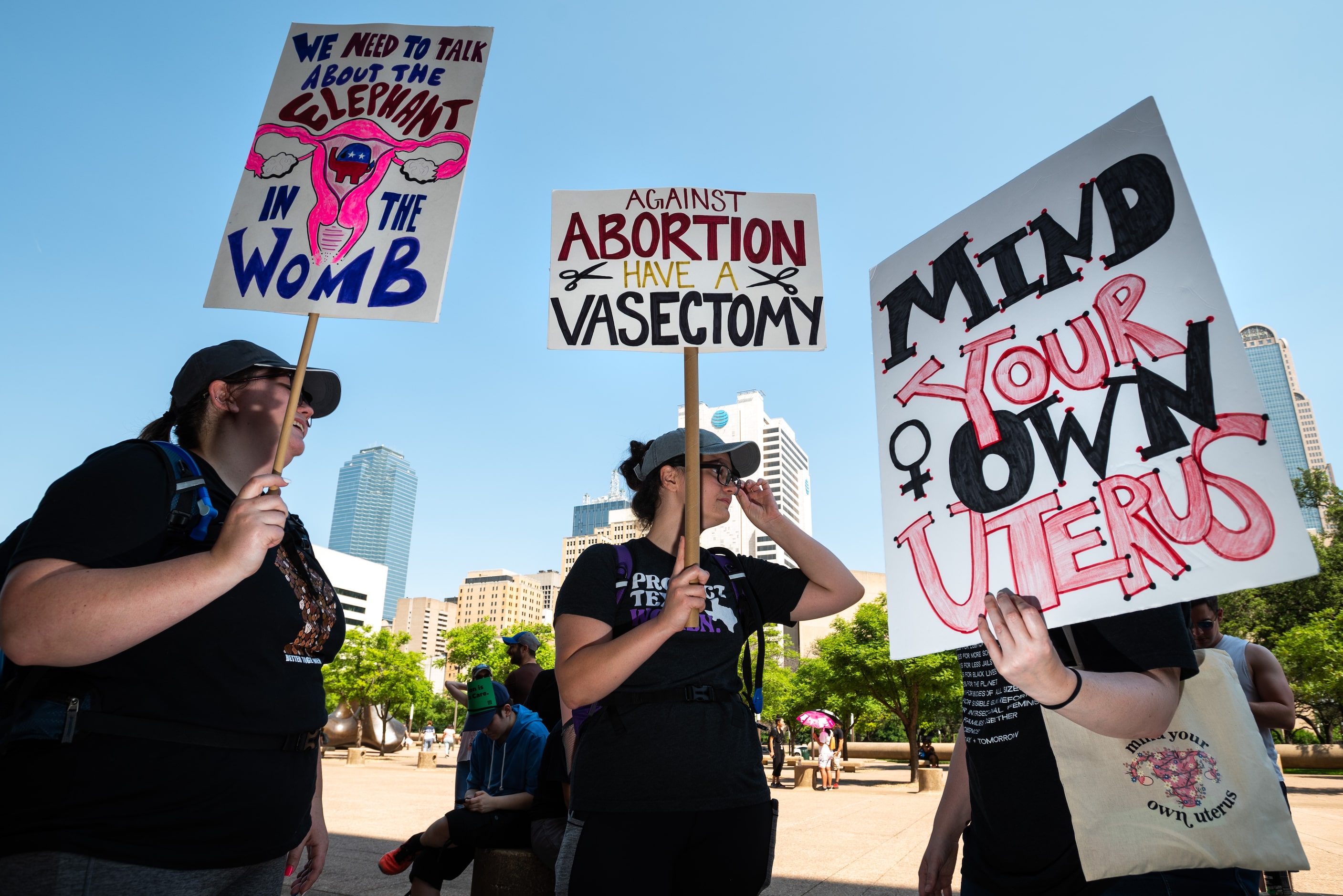 From left, Whitney Walker, 25, Brooke Walker, 28, of Austin, and Emma Beckerman, 28, talk to...