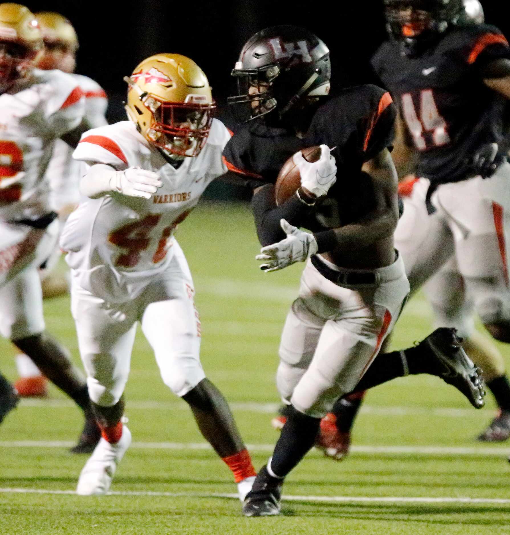 Lake Highlands High School Ladavion Osborn (5) is tackled returning a kickoff by South Grand...