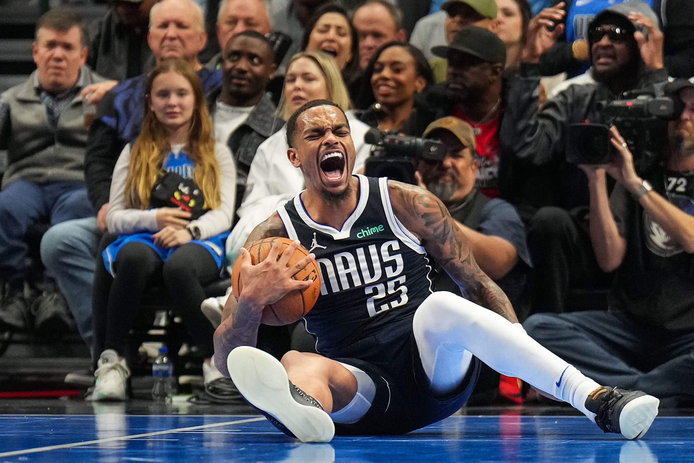 Dallas Mavericks forward P.J. Washington reacts after tying up Memphis Grizzlies forward...