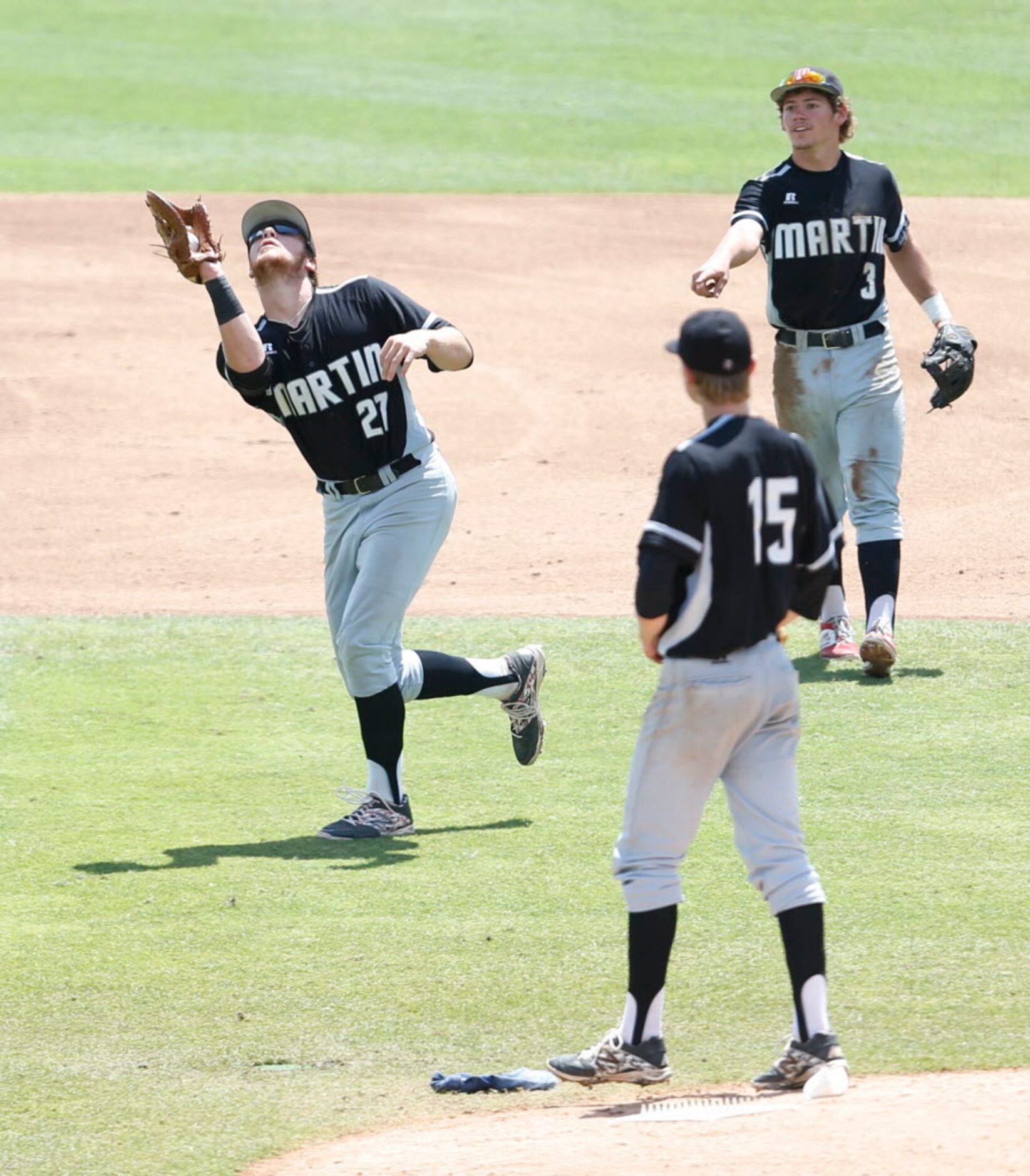 Martin's Aaron Fanning (27) catches a fly ball hit by Cypress Ranch's Ryan Leftwich (6)...