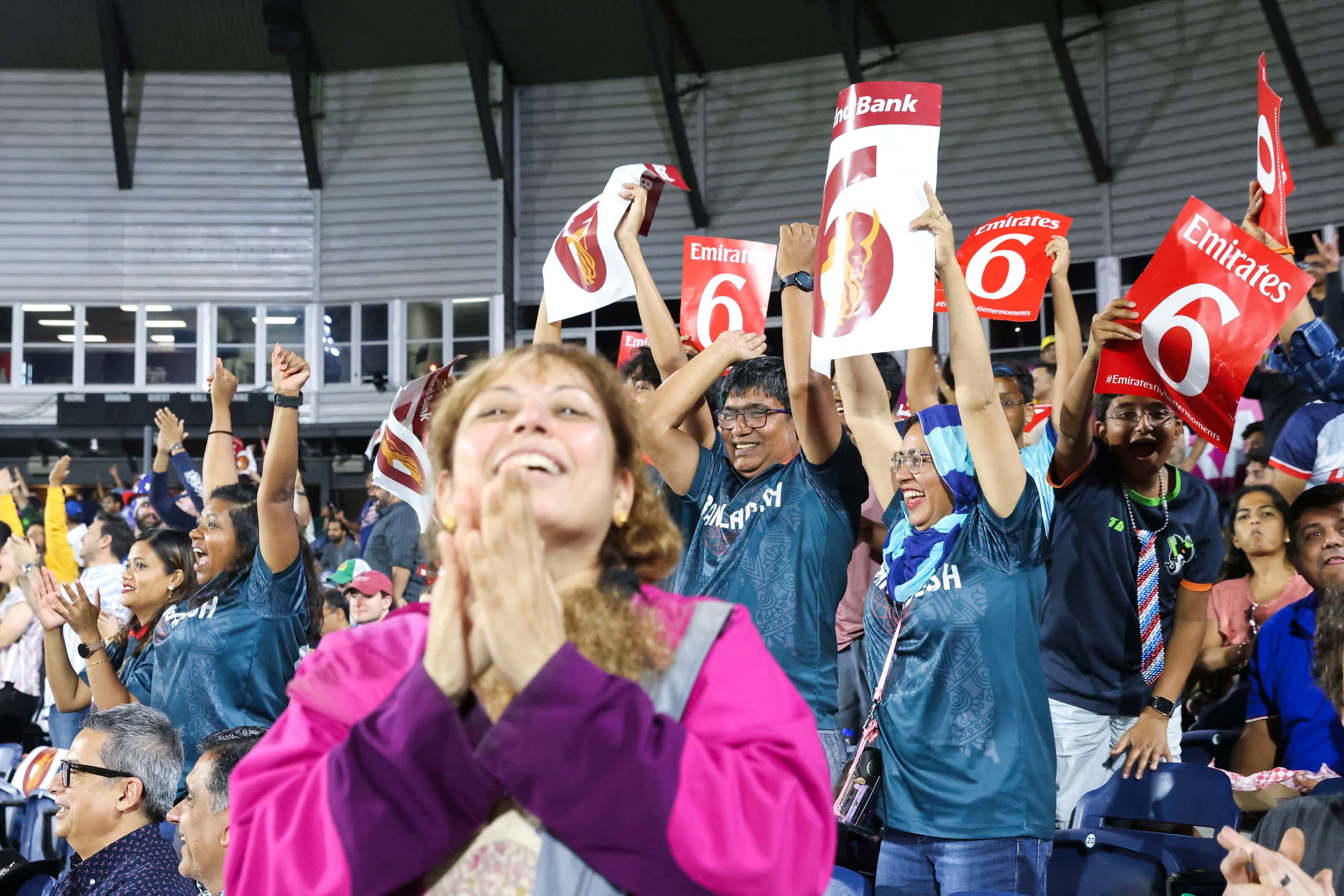 Fans cheer as United States' Aaron Jones hits a six runs during the men's T20 World Cup...