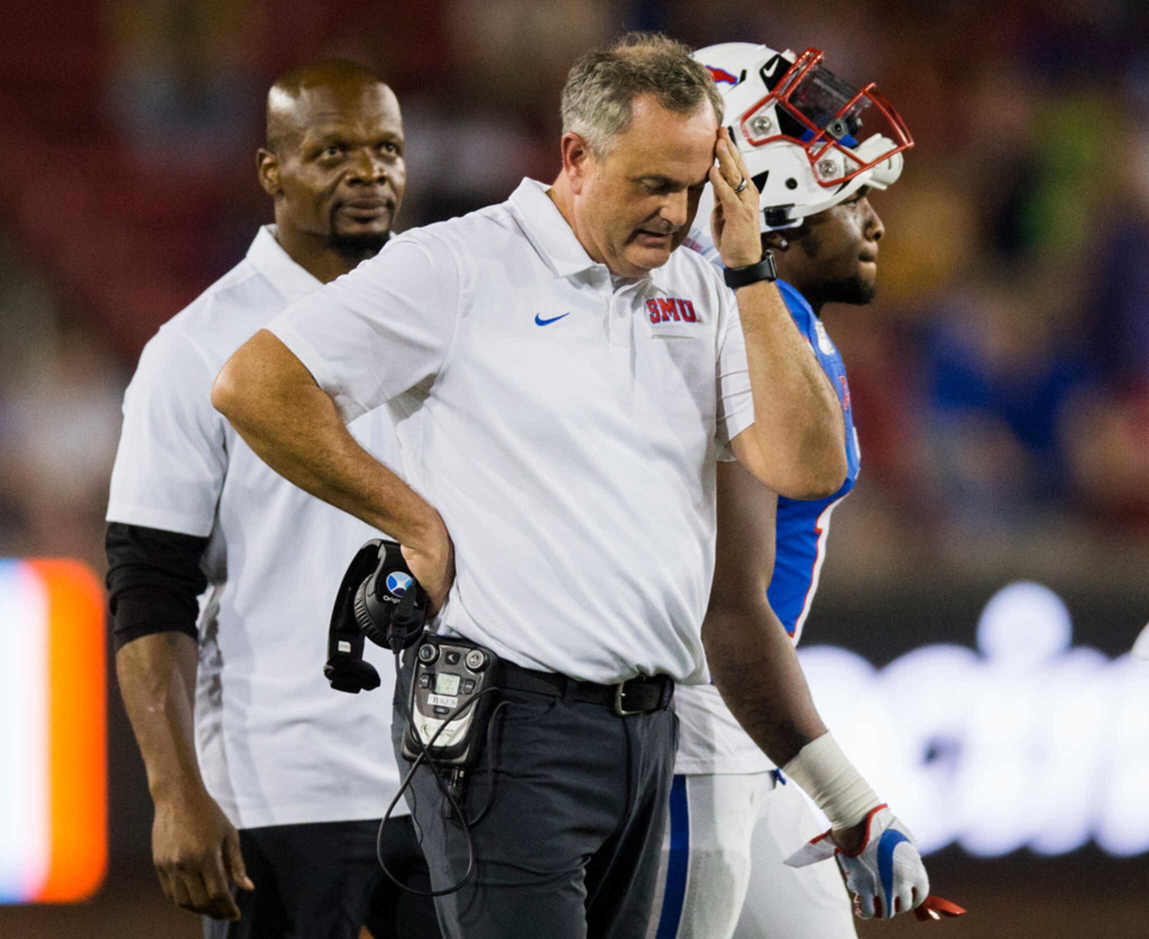 SMU Mustangs head coach Sonny Dykes puts his hand to his forehead during a timeout in double...