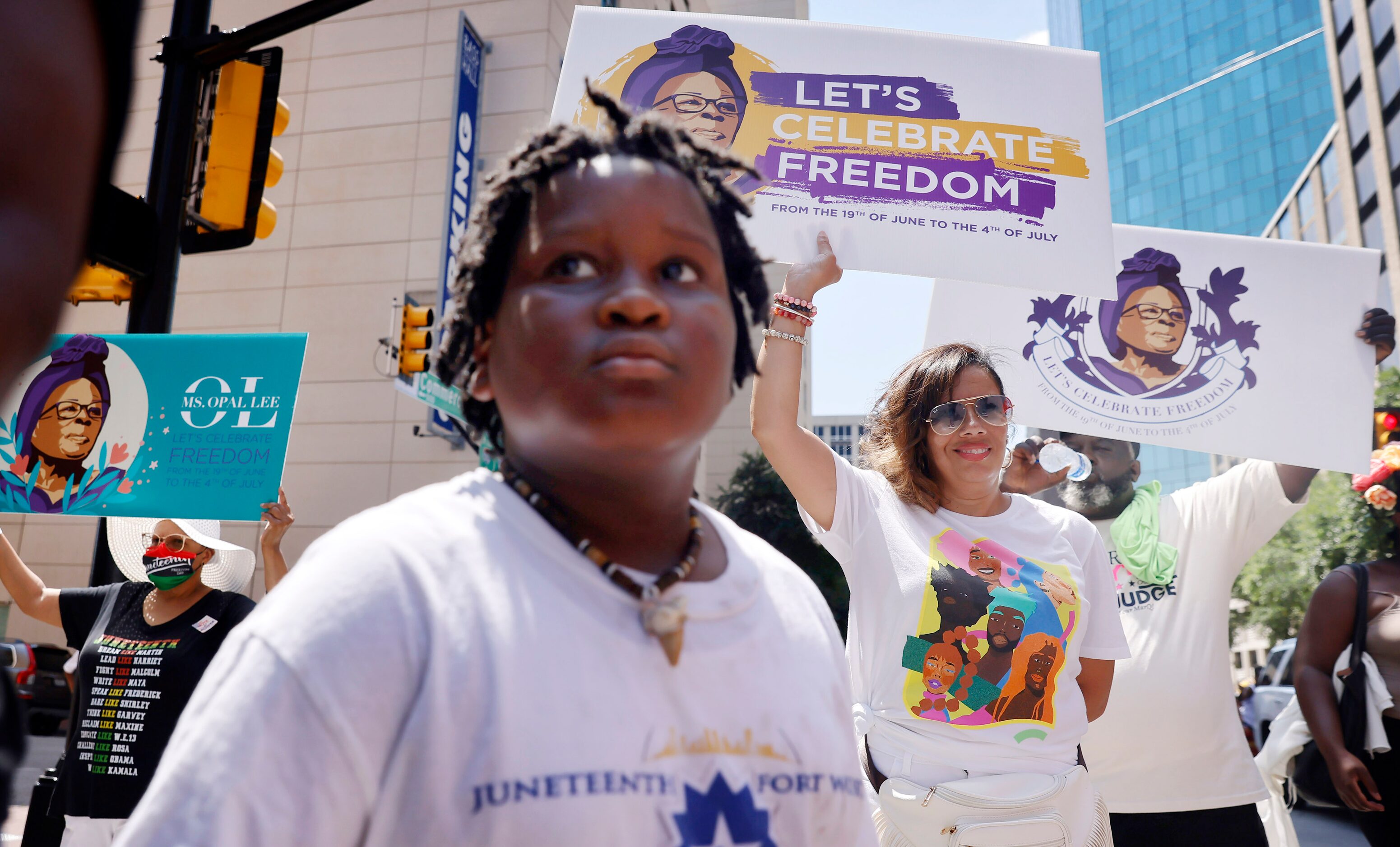 Supporters of Opal Lee and her Juneteenth walk event make the holiday hot trek through...