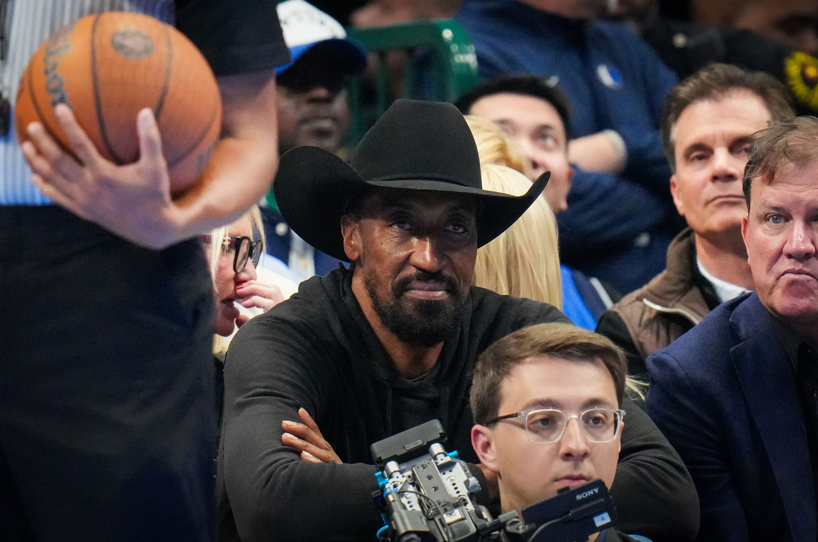 Scotty Pippen watches during the first half of an NBA basketball game between the Dallas...