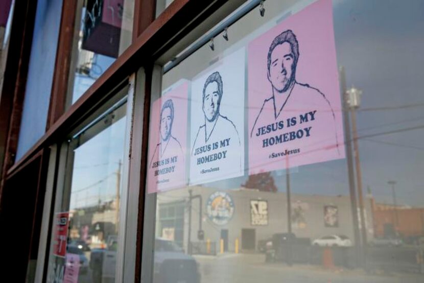 
Fliers in the window of Glazed Donut Works in Deep Ellum support fired neighborhood...