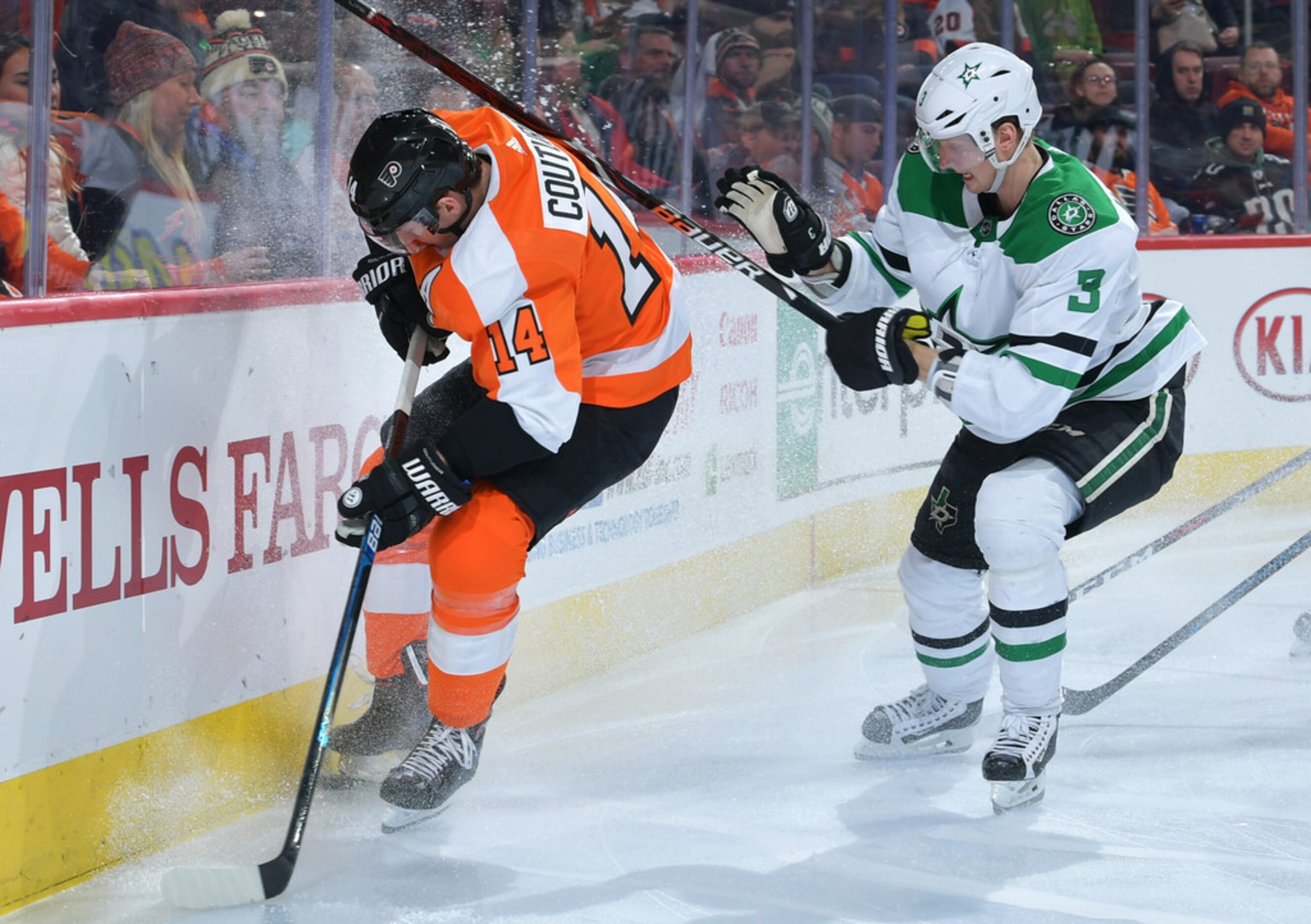 PHILADELPHIA, PENNSYLVANIA - JANUARY 10: Sean Couturier #14 of the Philadelphia Flyers gets...