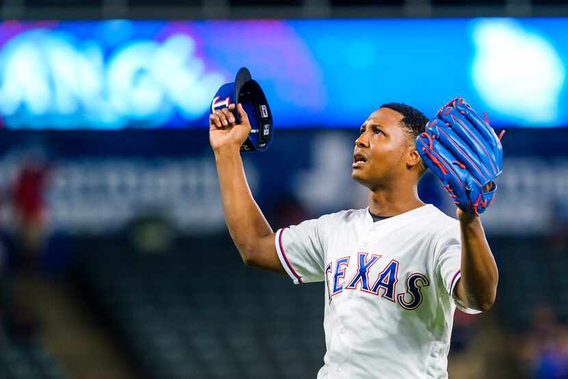 FILE - Rangers relief pitcher Jose Leclerc celebrates the final out of a 10-9 win over the...