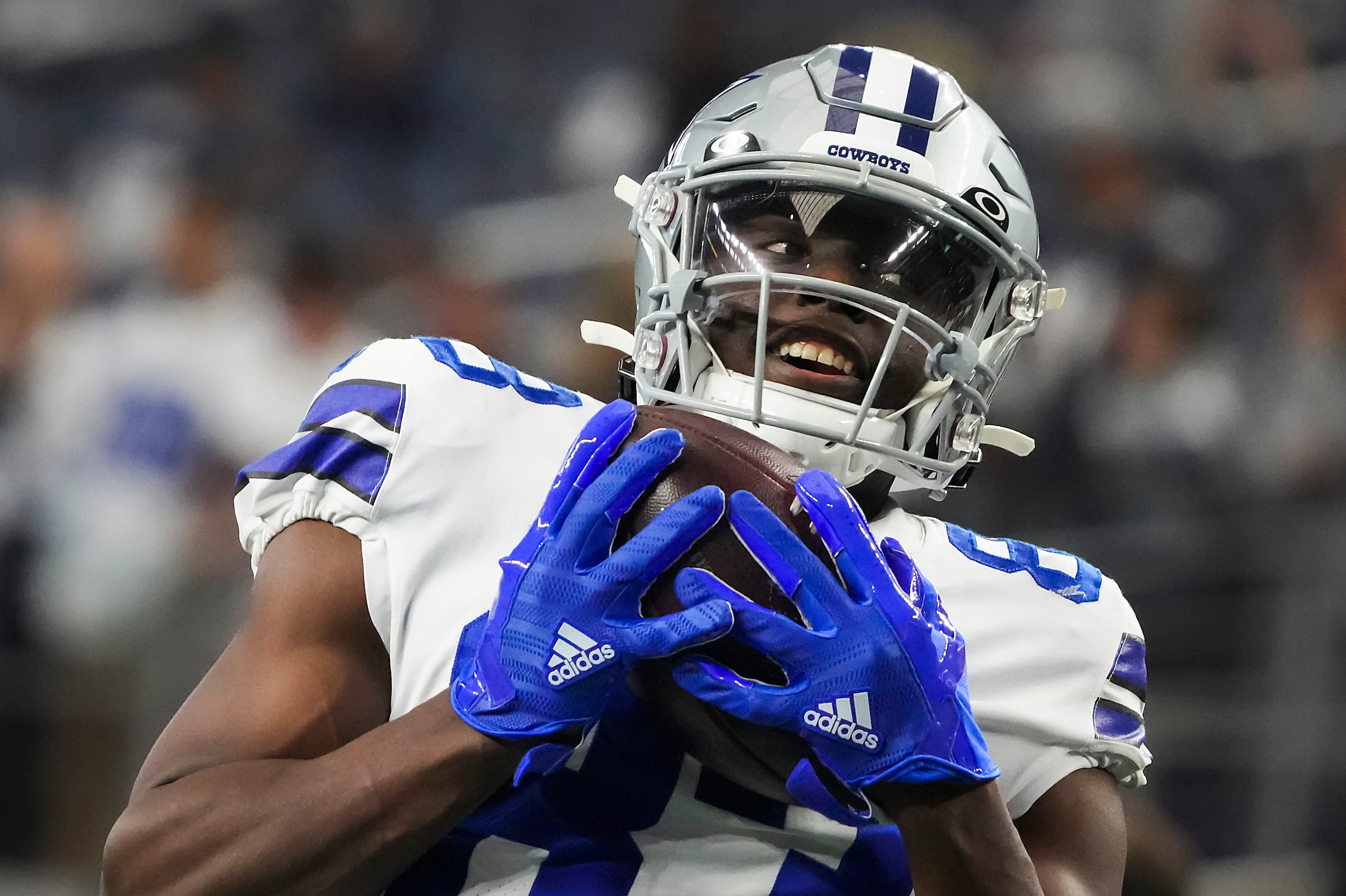 Dallas Cowboys wide receiver James Washington (83) warms up before an NFL football game...