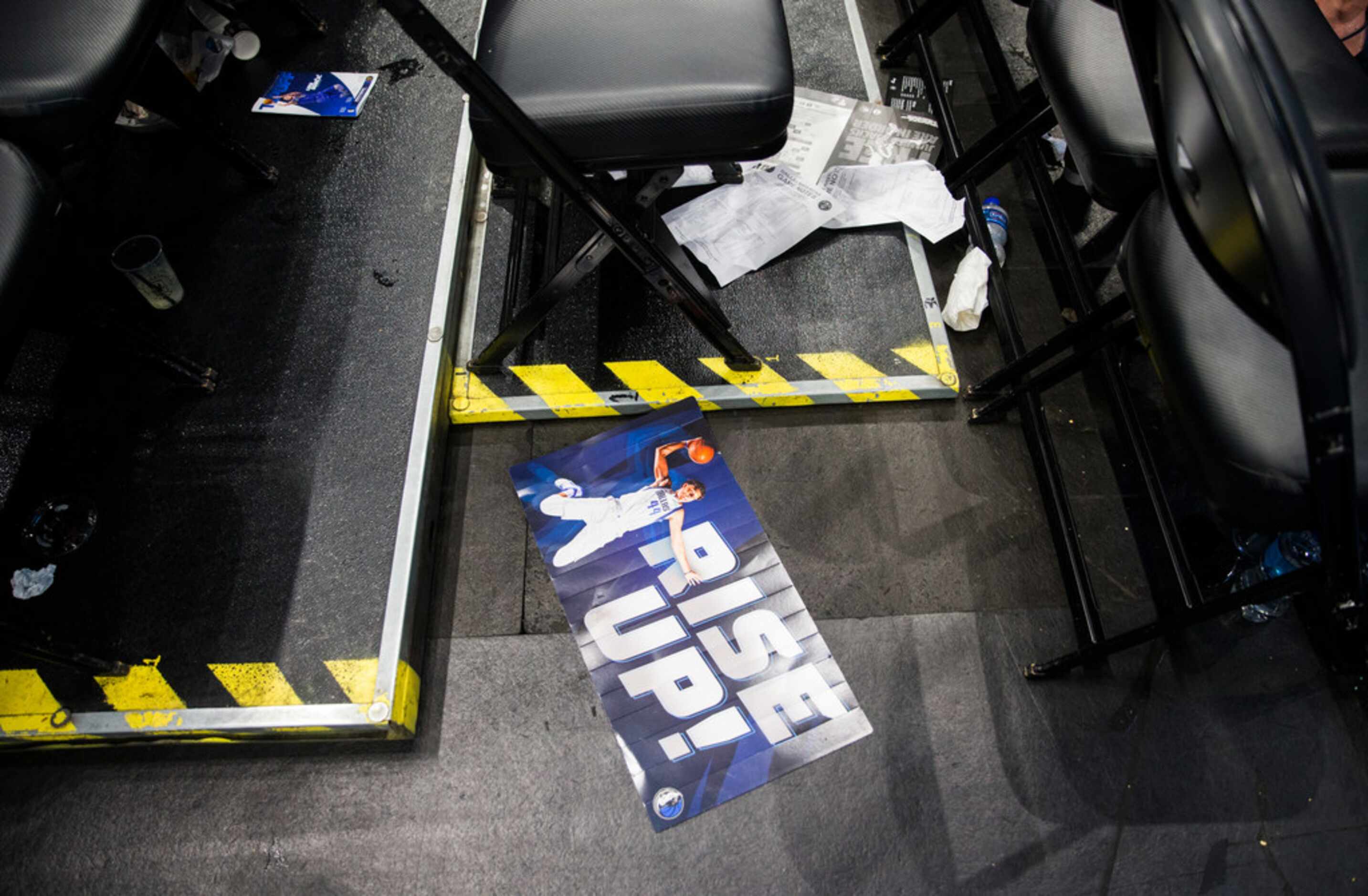 A sign left by a fan lays on the ground after the Dallas Mavericks beat the Denver Nuggets...