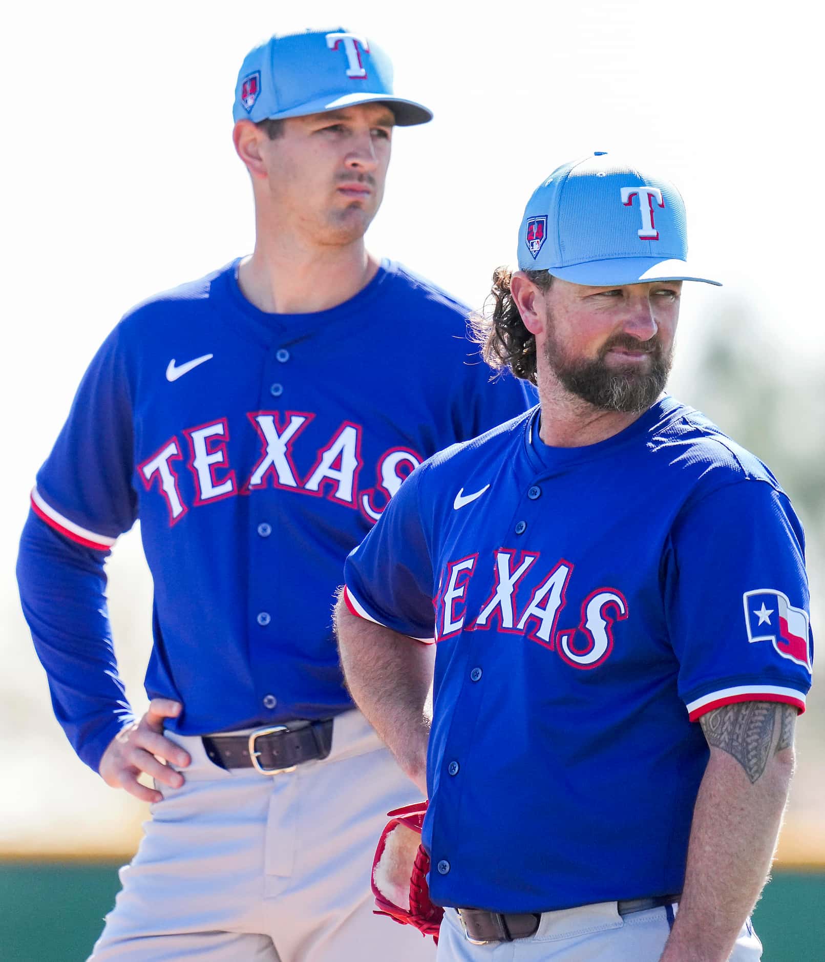 Texas Rangers pitcher Kirby Yates (right) and pitcher Tyler Mahle participate in a fielding...