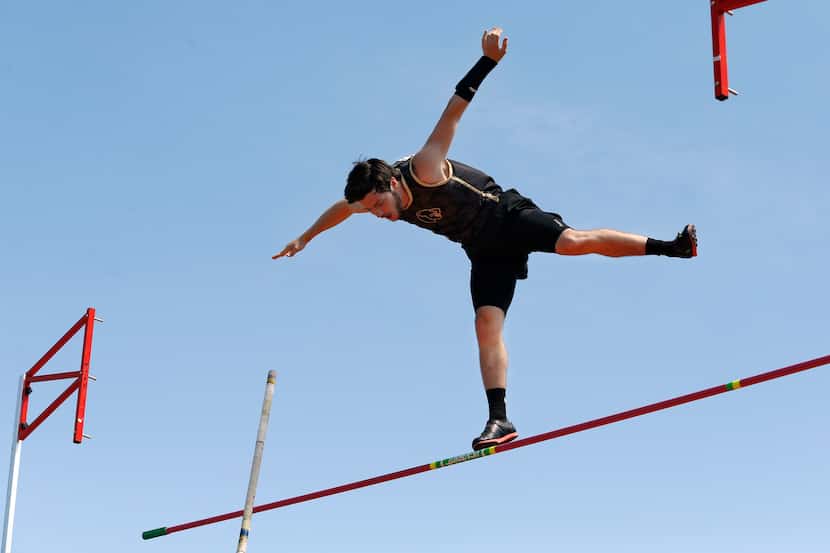 Pole vaulter Connor Gregston of Keller Fossil Ridge appears to be standing on the crossbar...