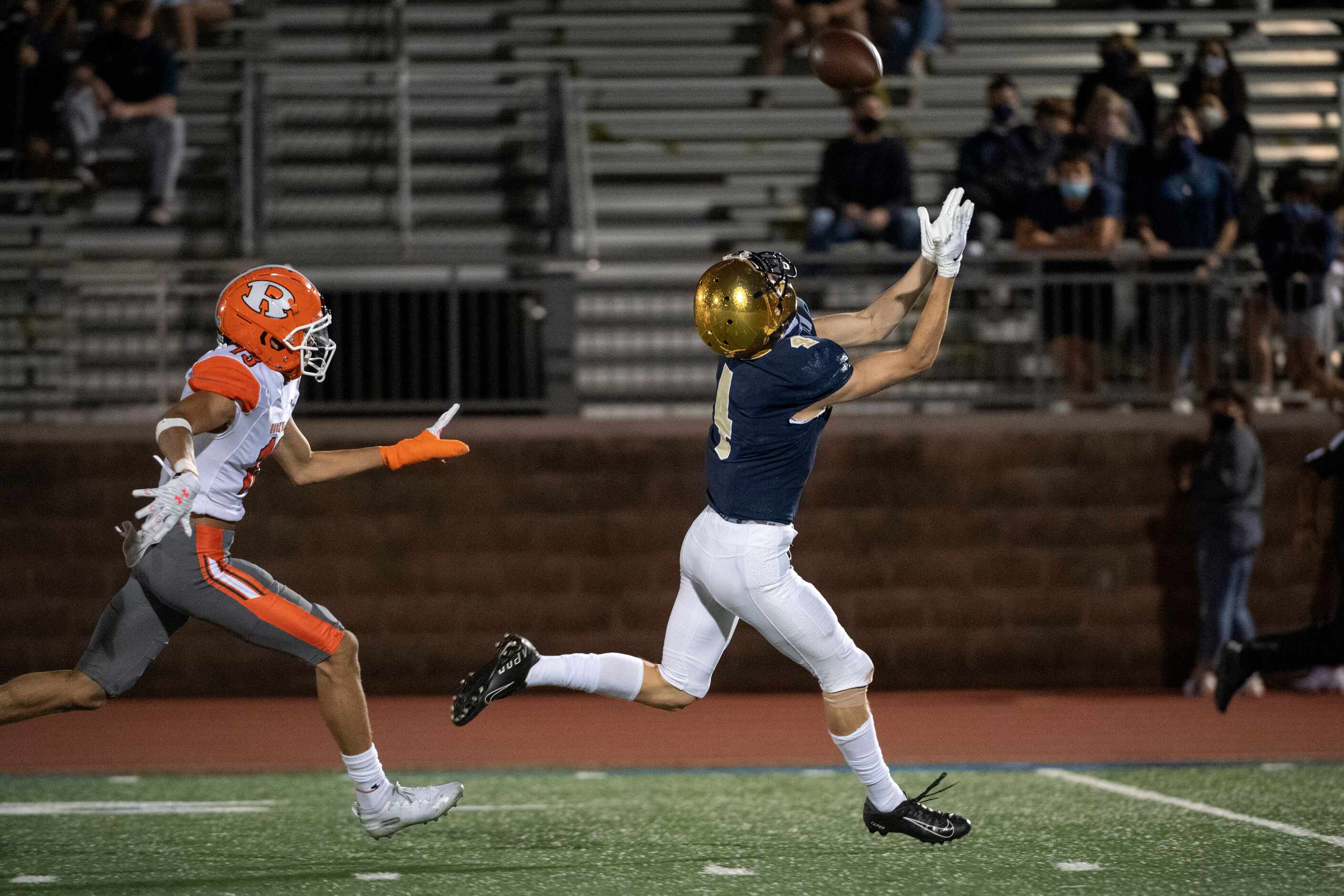 Jesuit junior wide receiver Cole Younger (4) hauls in a touchdown pass in front of Rockwall...