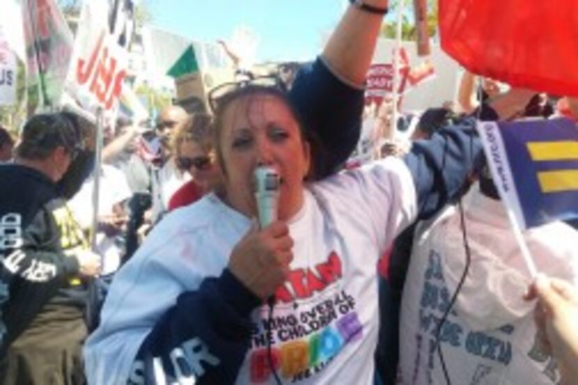  Tracy Grisham of Amarillo addresses the crowd outside the Supreme Court. (Michael Marks/staff)