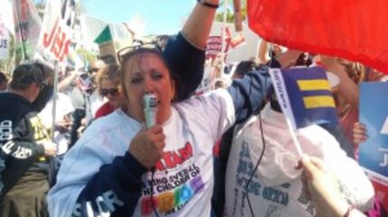  Tracy Grisham of Amarillo addresses the crowd outside the Supreme Court. (Michael Marks/staff)