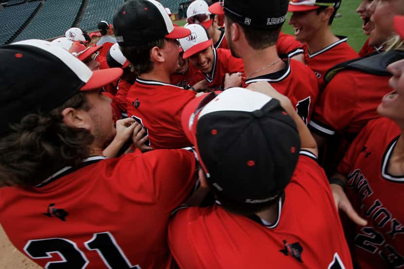 Members of the Lovejoy varsity baseball team revel in the moment as they celebrate their...