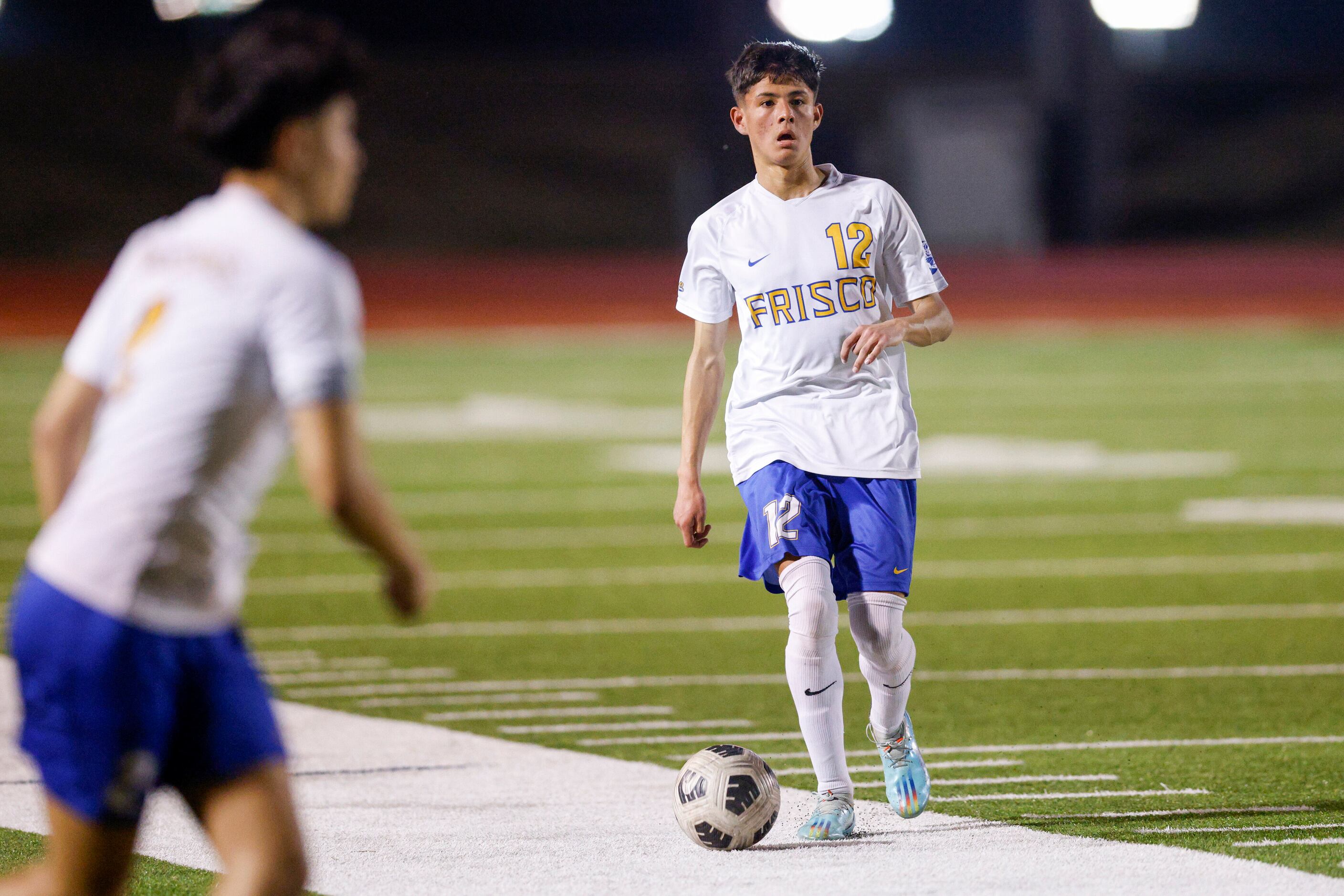 Frisco’s Diego Rodriguez (12) dribbles the ball up the field during the first half of a...