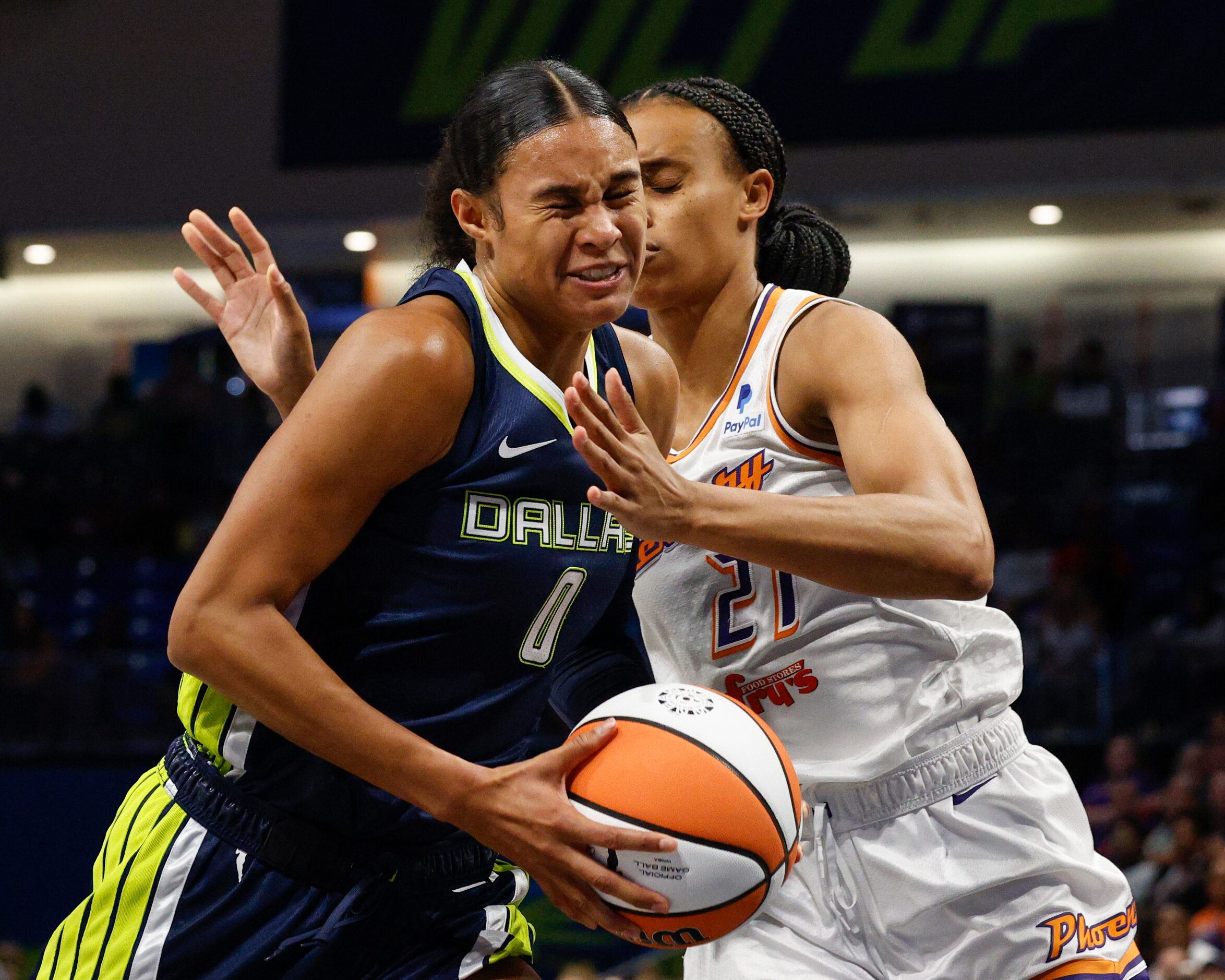 Dallas Wings forward Satou Sabally (0) drives through the paint past Phoenix Mercury forward...