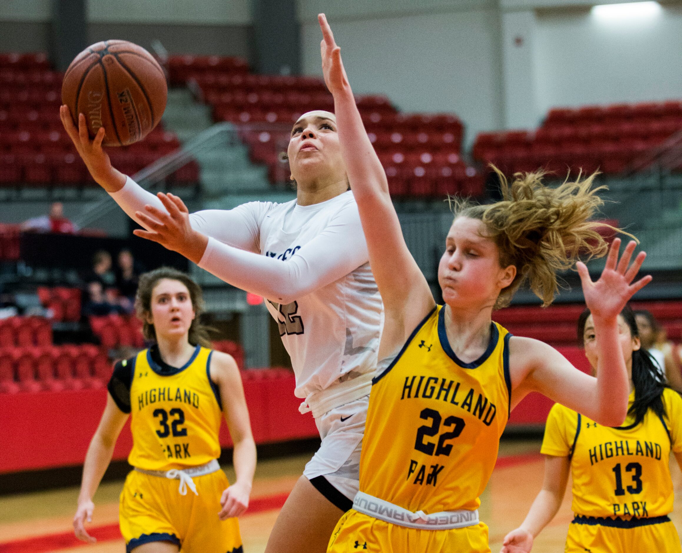 Frisco Lone Star forward Victoria Gooden (22) takes a shot over Highland Park guard Cate...