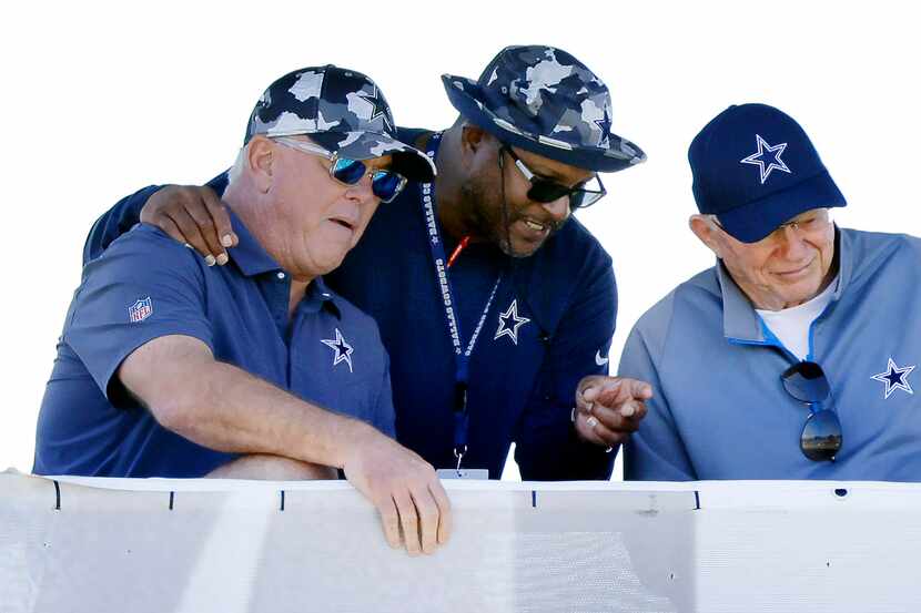Dallas Cowboys Vice President of Player Personnel Will McClay (center) visits with owner...